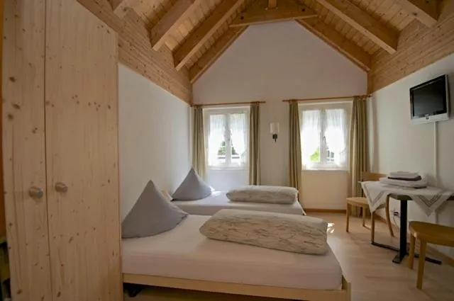 Photo of the whole room, Bed in Gasthaus Skiklub
