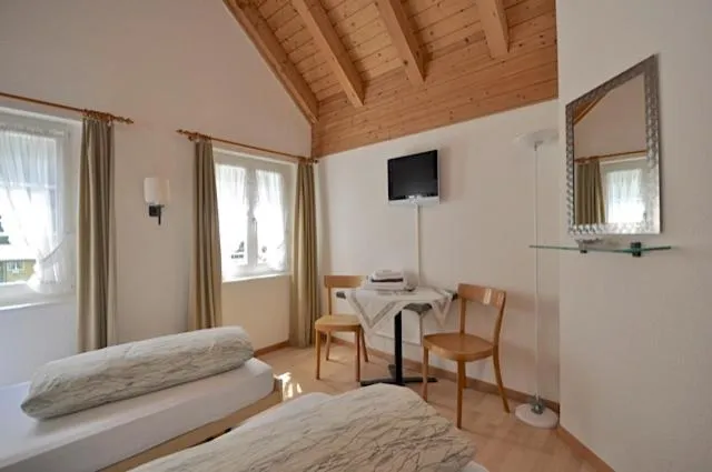 Photo of the whole room, Bed in Gasthaus Skiklub