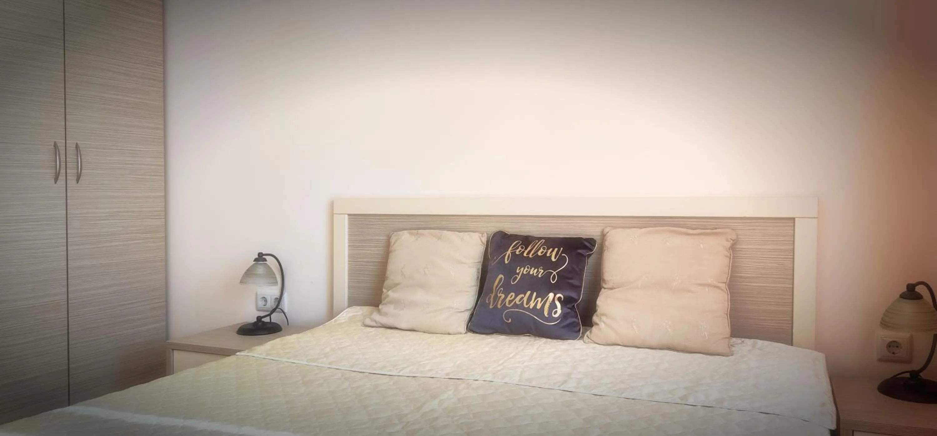 Bed in Royal Sun Apartments