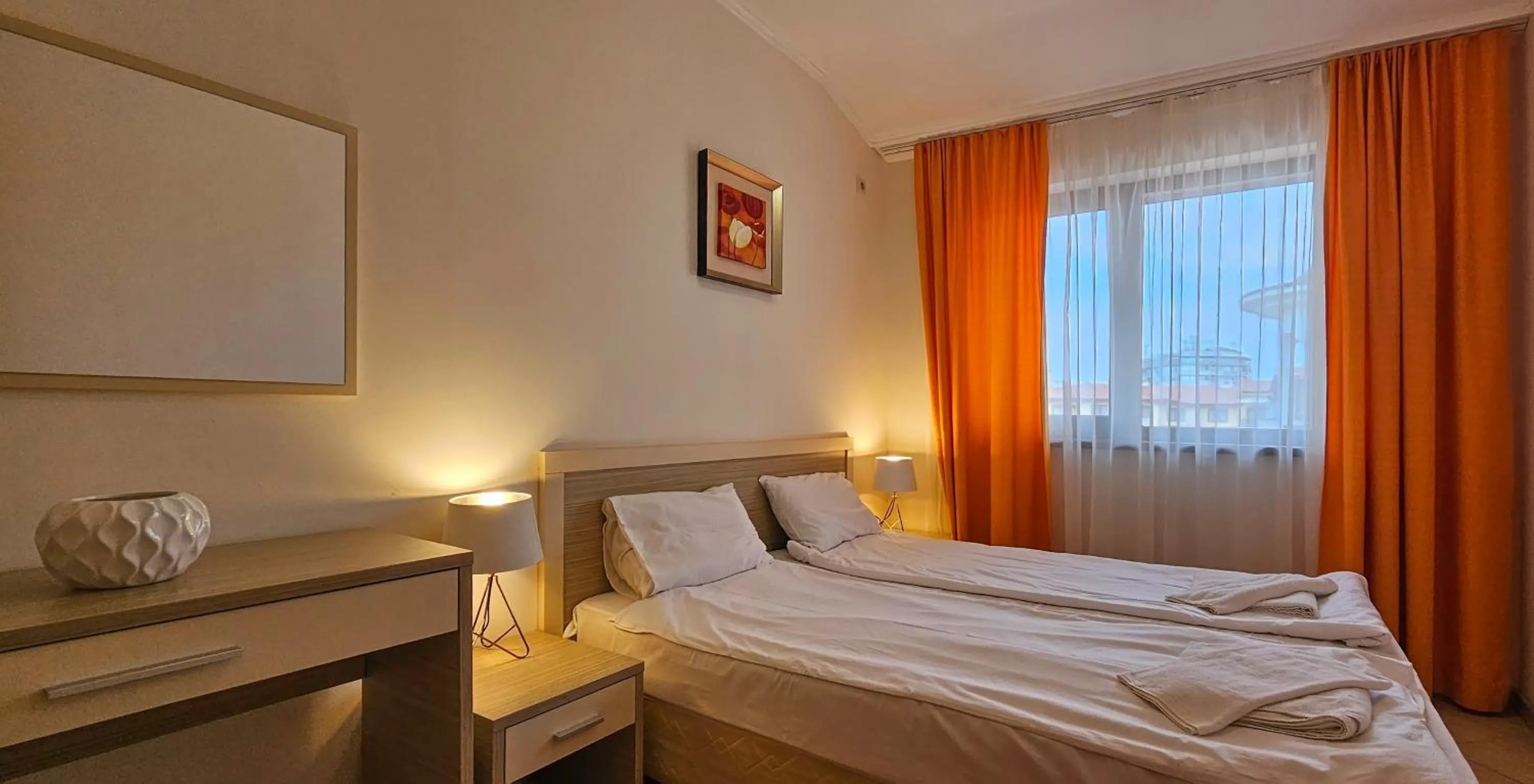 Bed in Royal Sun Apartments