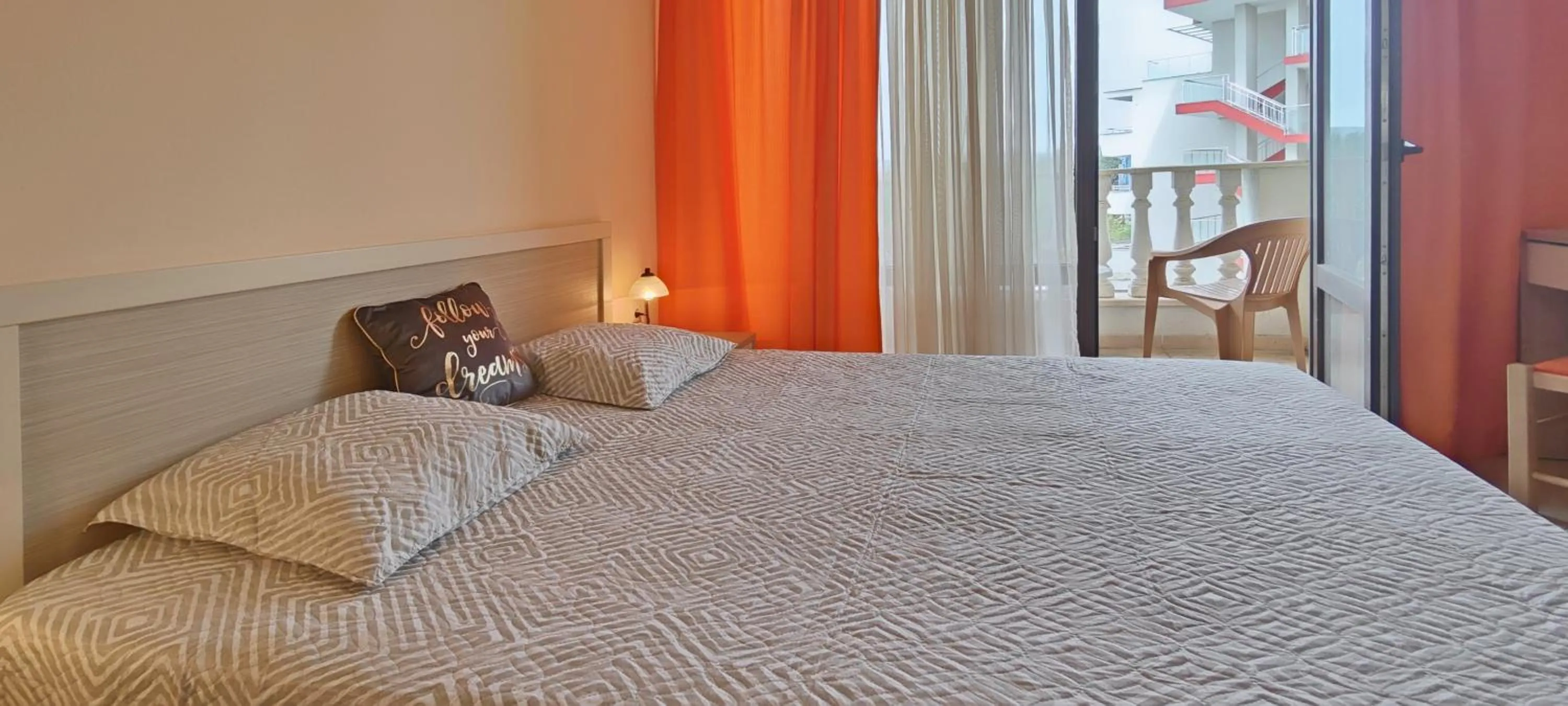 Bed in Royal Sun Apartments