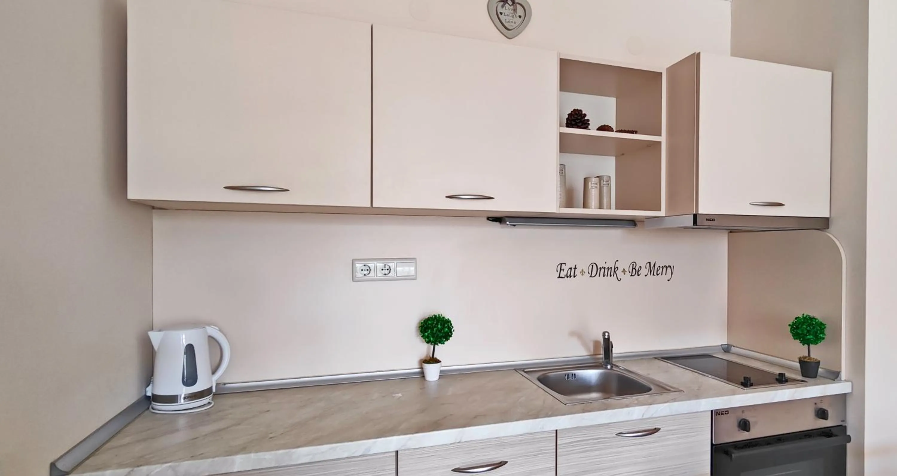 Kitchen or kitchenette in Royal Sun Apartments