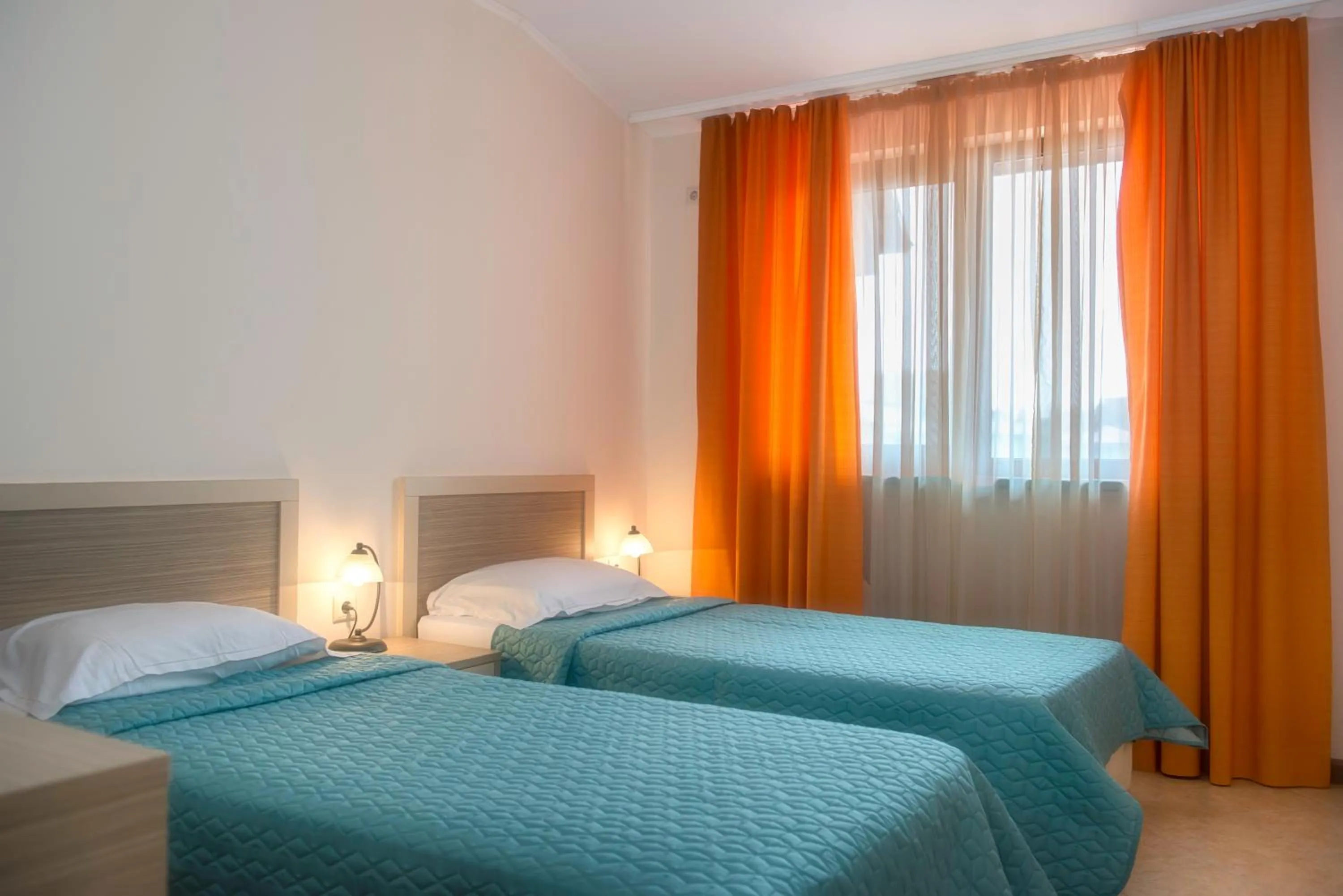 Bed in Royal Sun Apartments