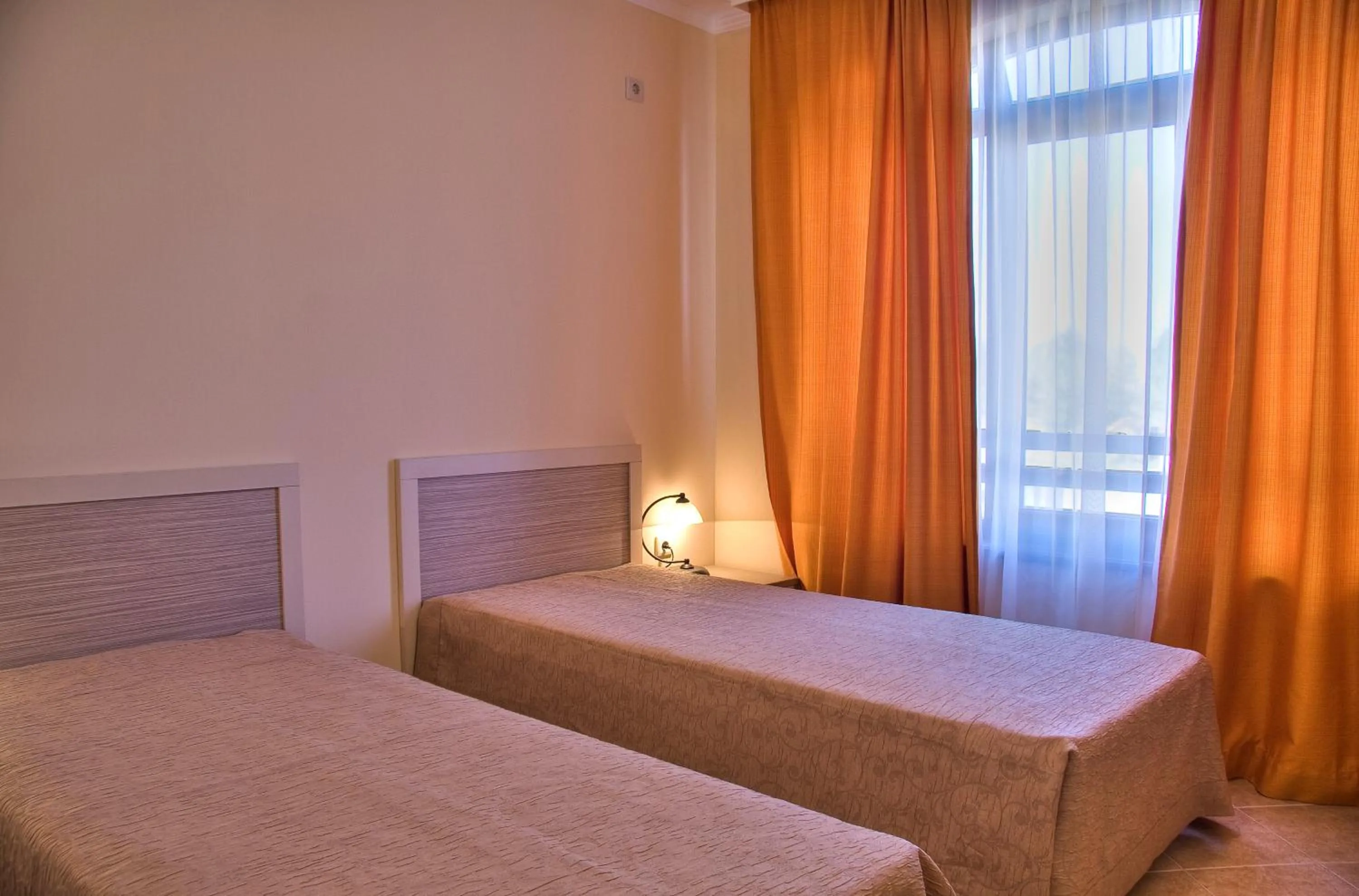 Bed in Royal Sun Apartments