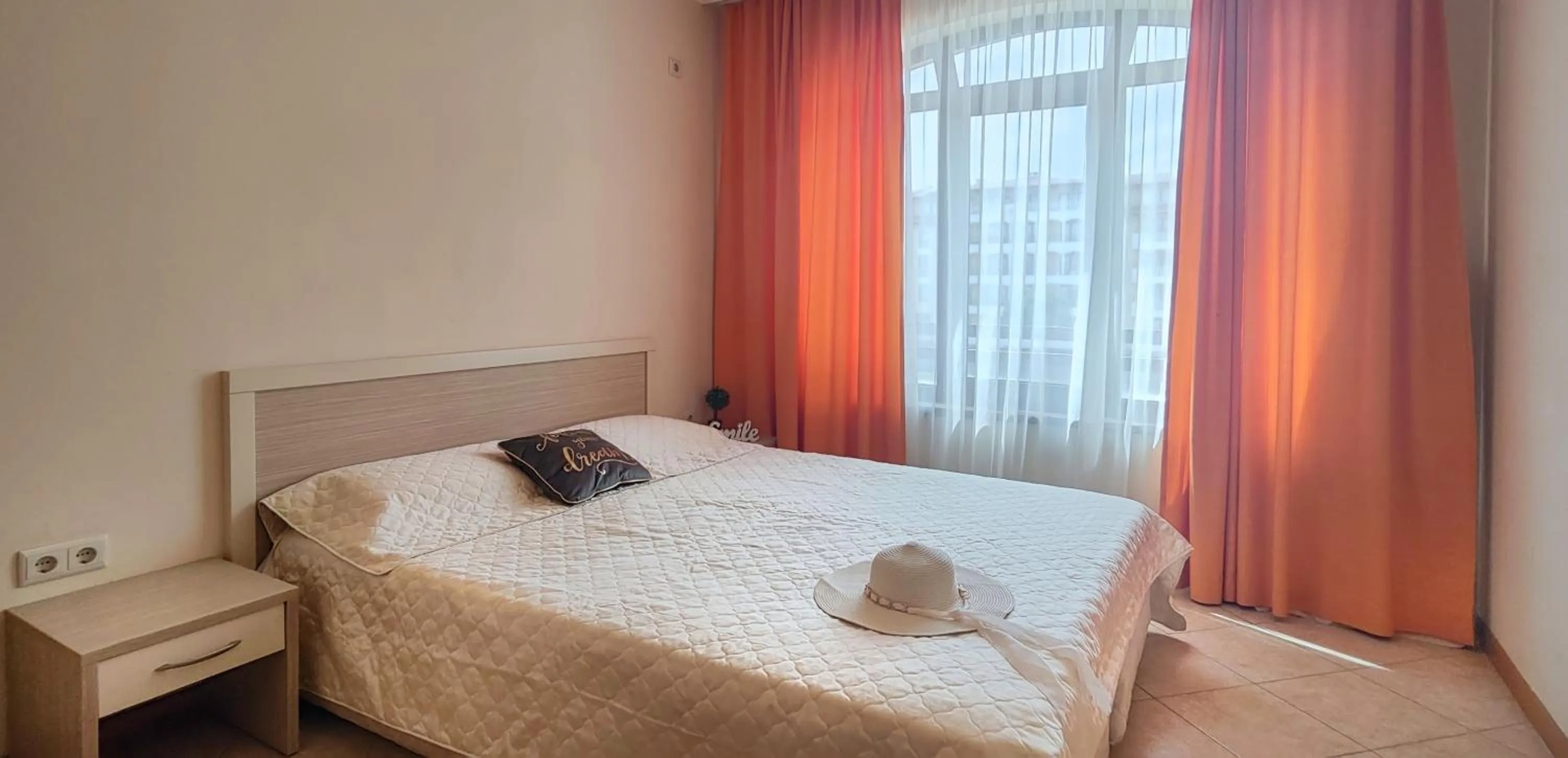 Bed in Royal Sun Apartments