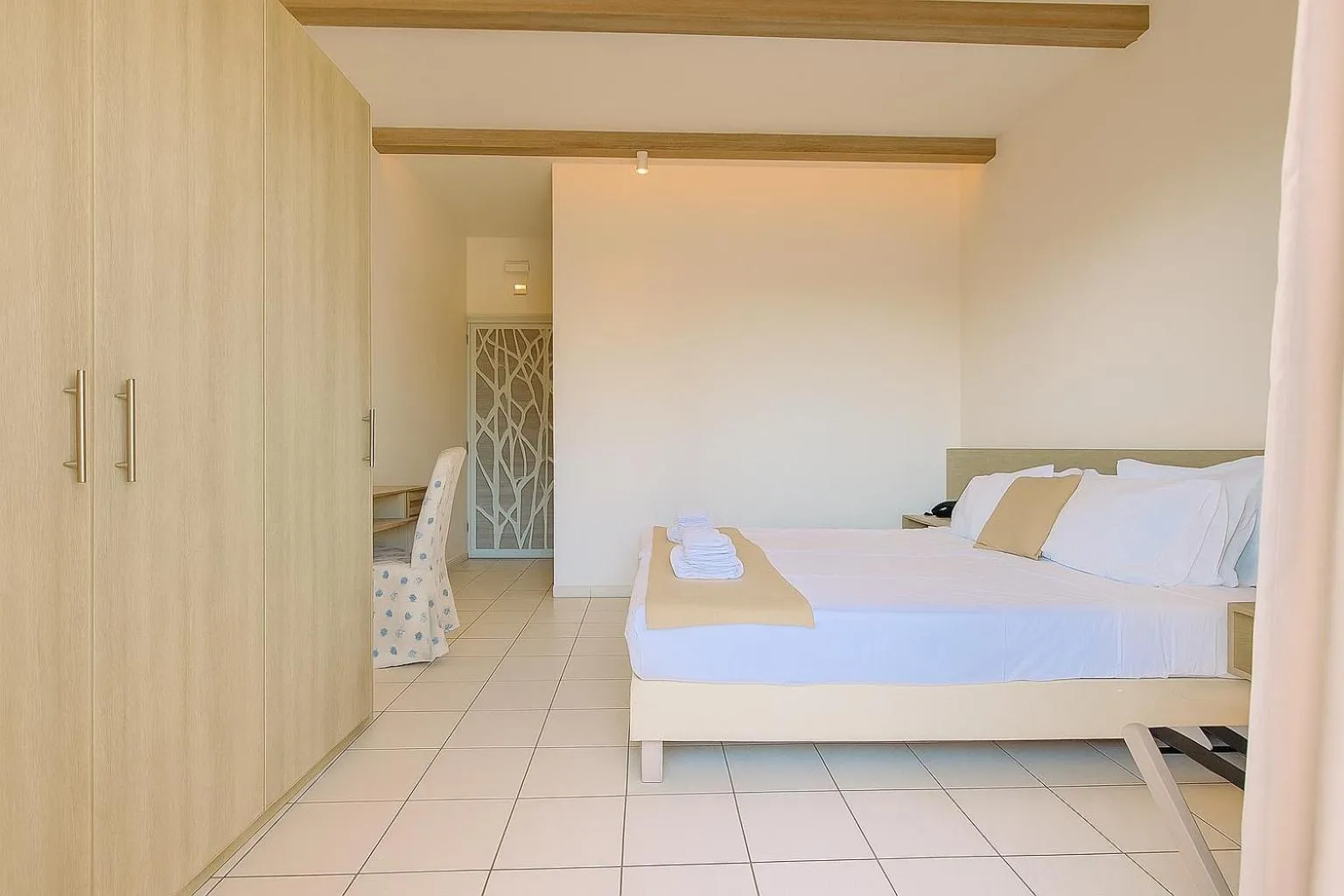 Bed in Porto Greco Village Beach Hotel