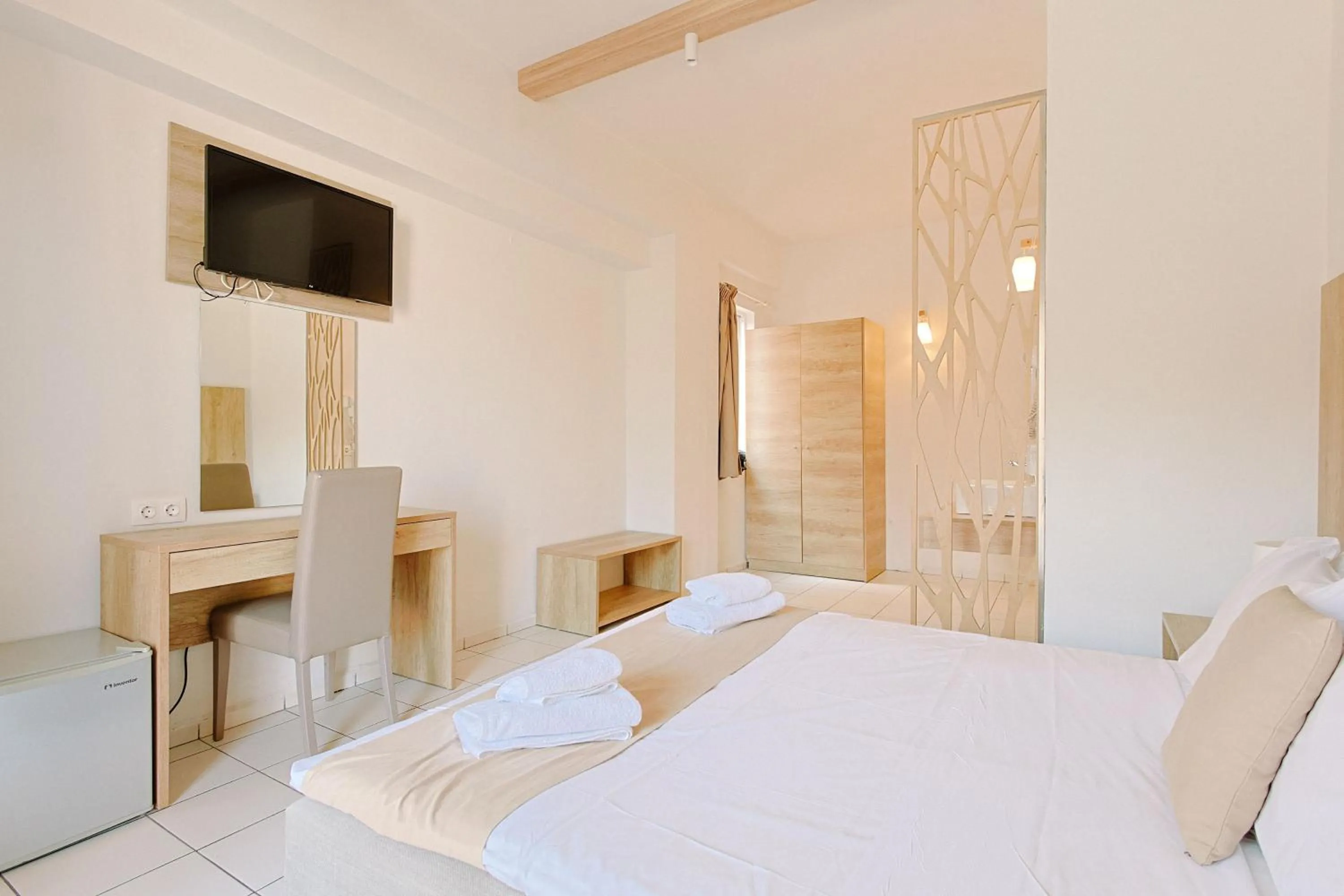 Bed in Porto Greco Village Beach Hotel