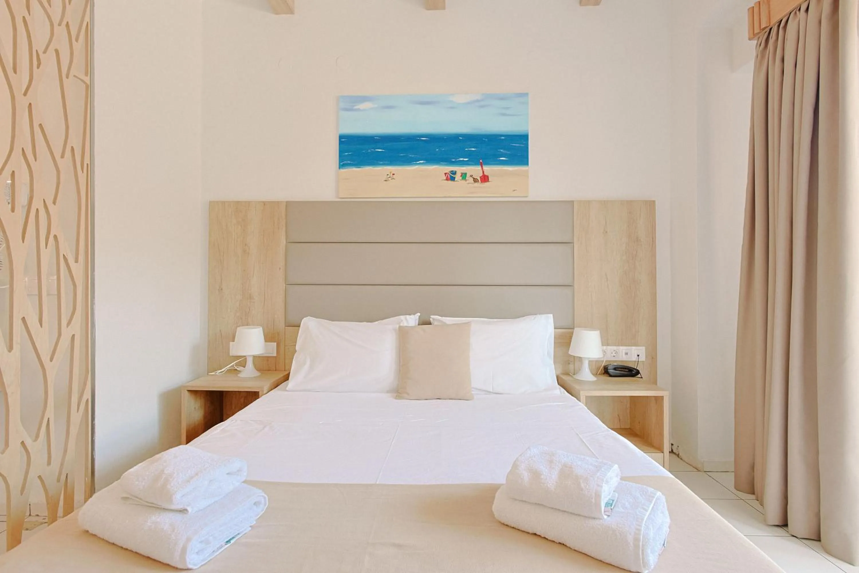 Bed in Porto Greco Village Beach Hotel
