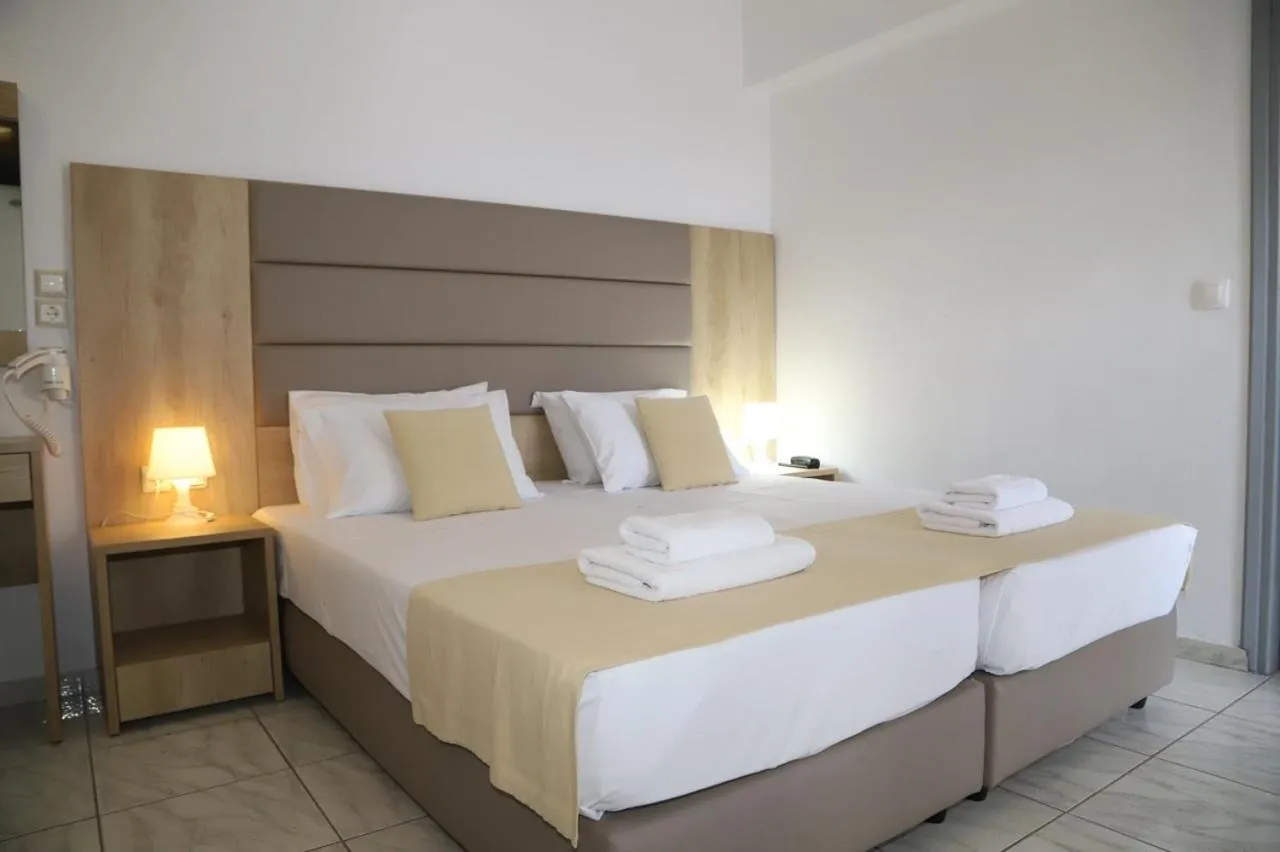 Bed in Porto Greco Village Beach Hotel