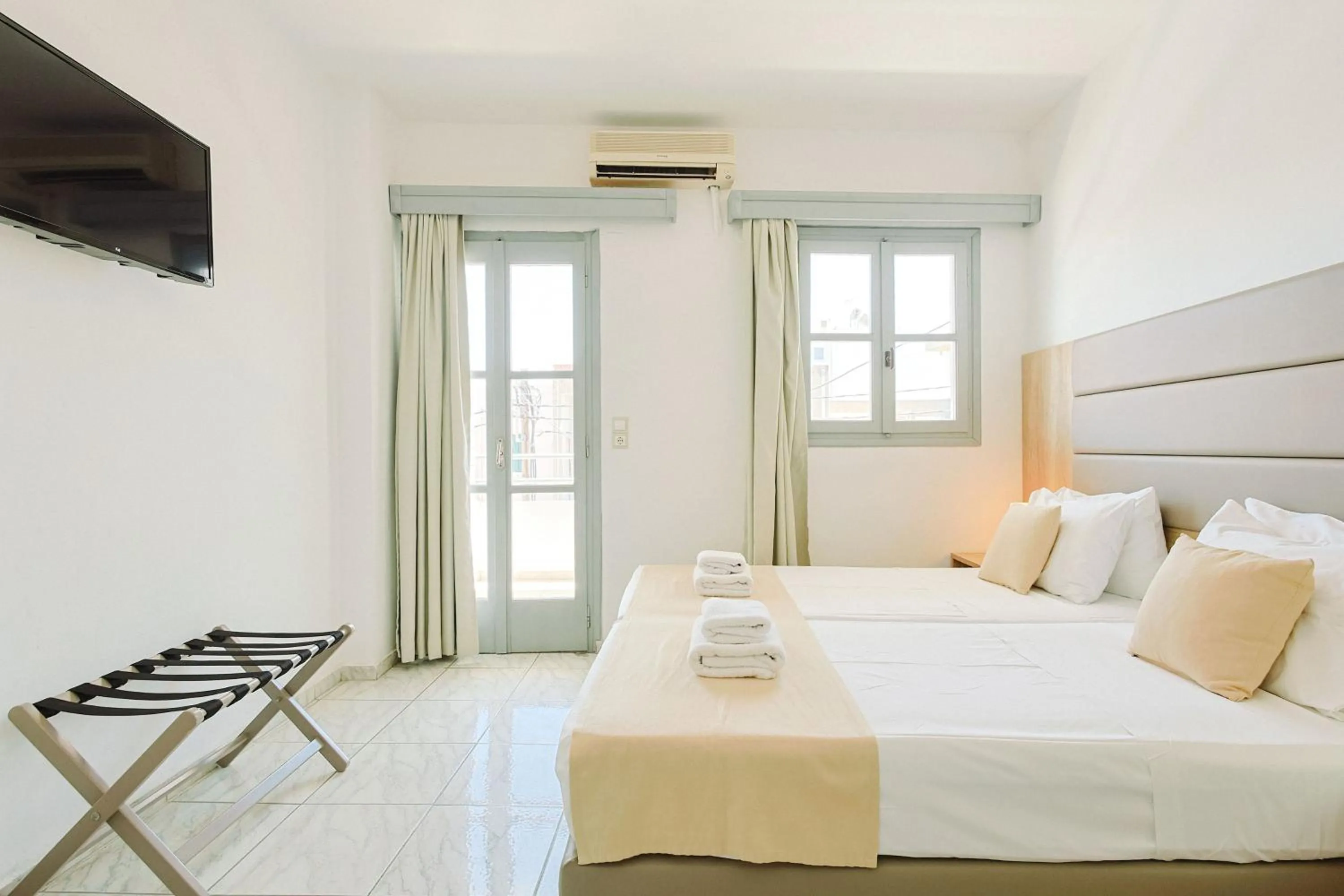 Bed in Porto Greco Village Beach Hotel