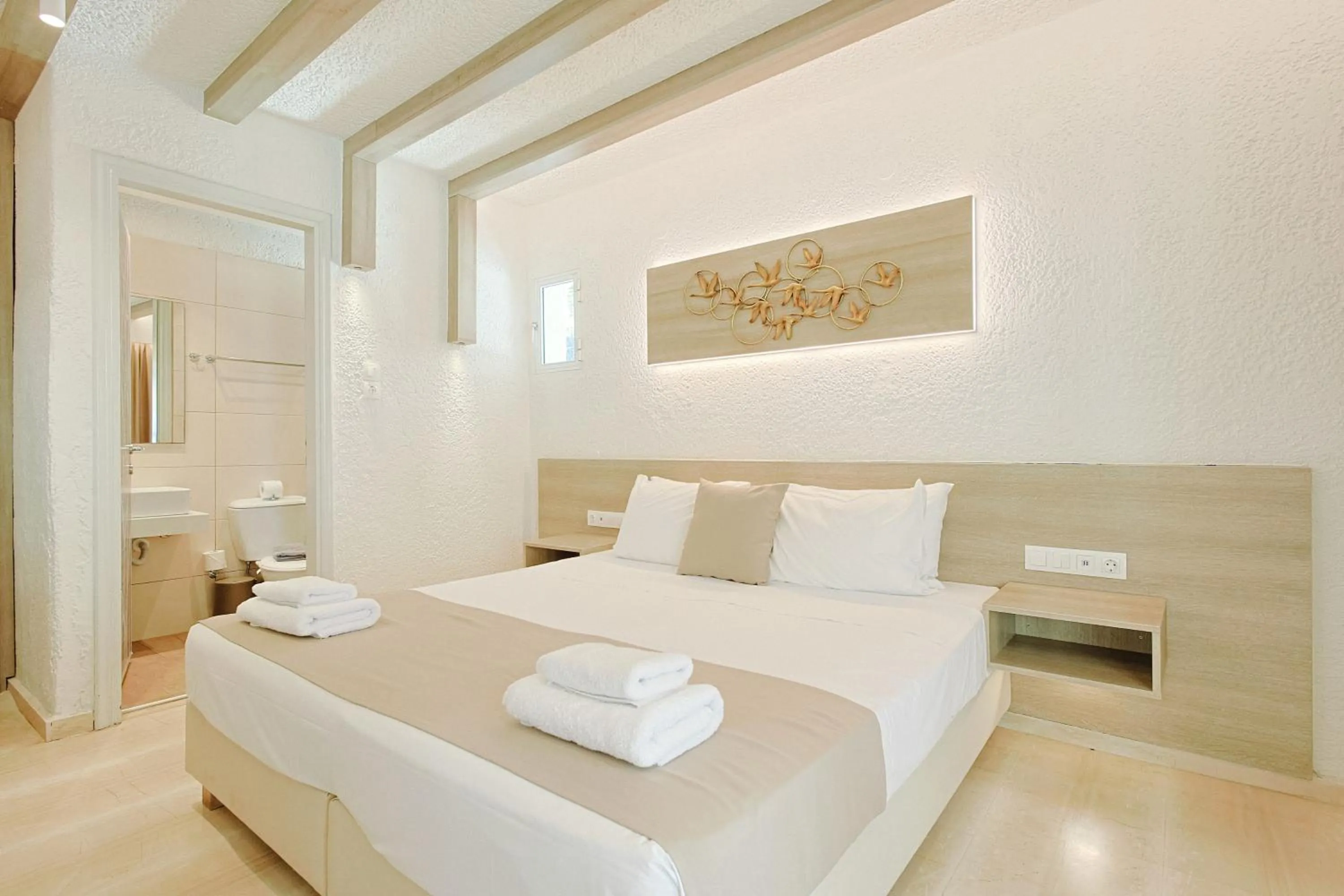 Bed in Porto Greco Village Beach Hotel