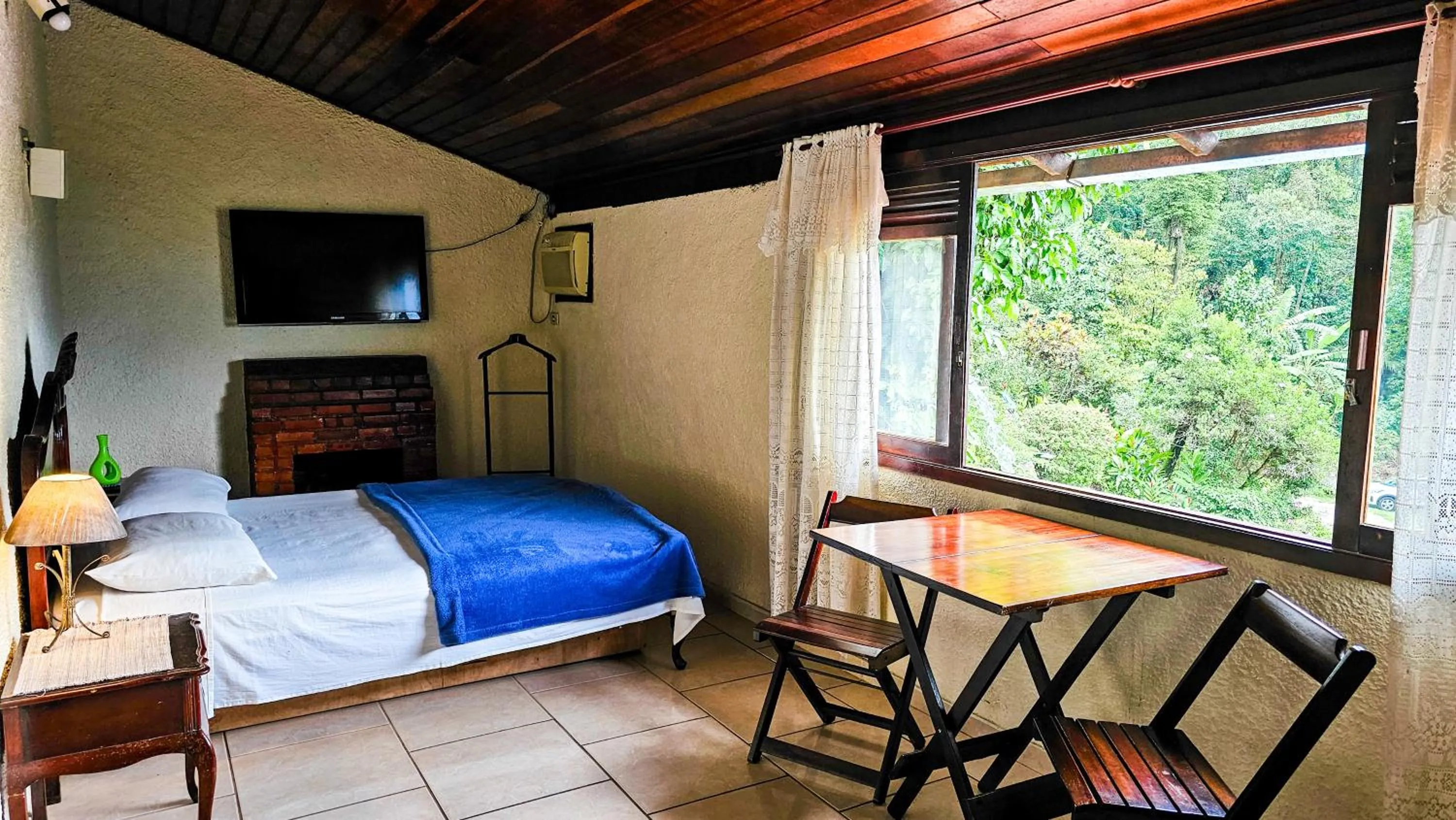 Bed in Pousada Chale da Montanha