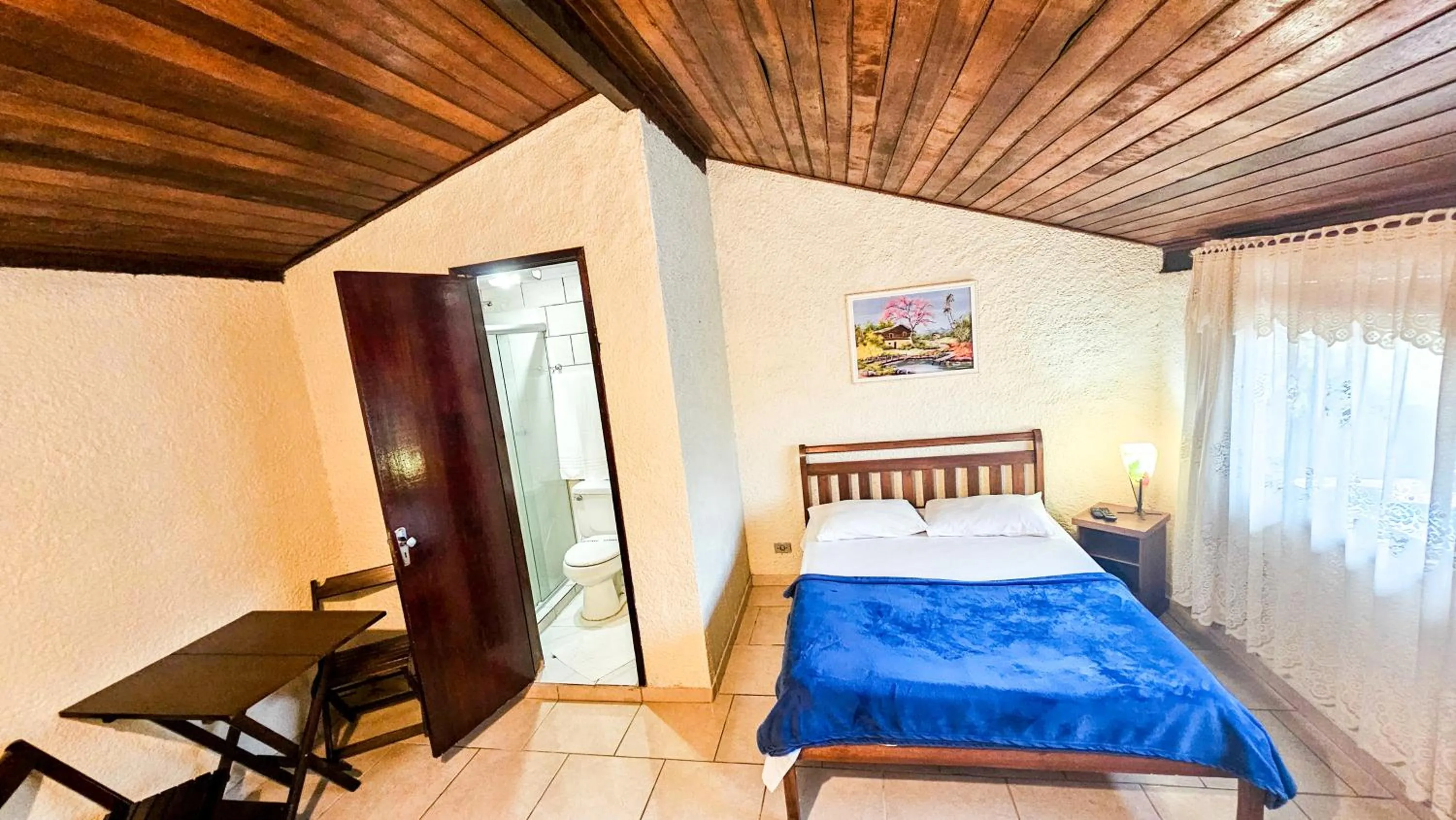 Bed in Pousada Chale da Montanha