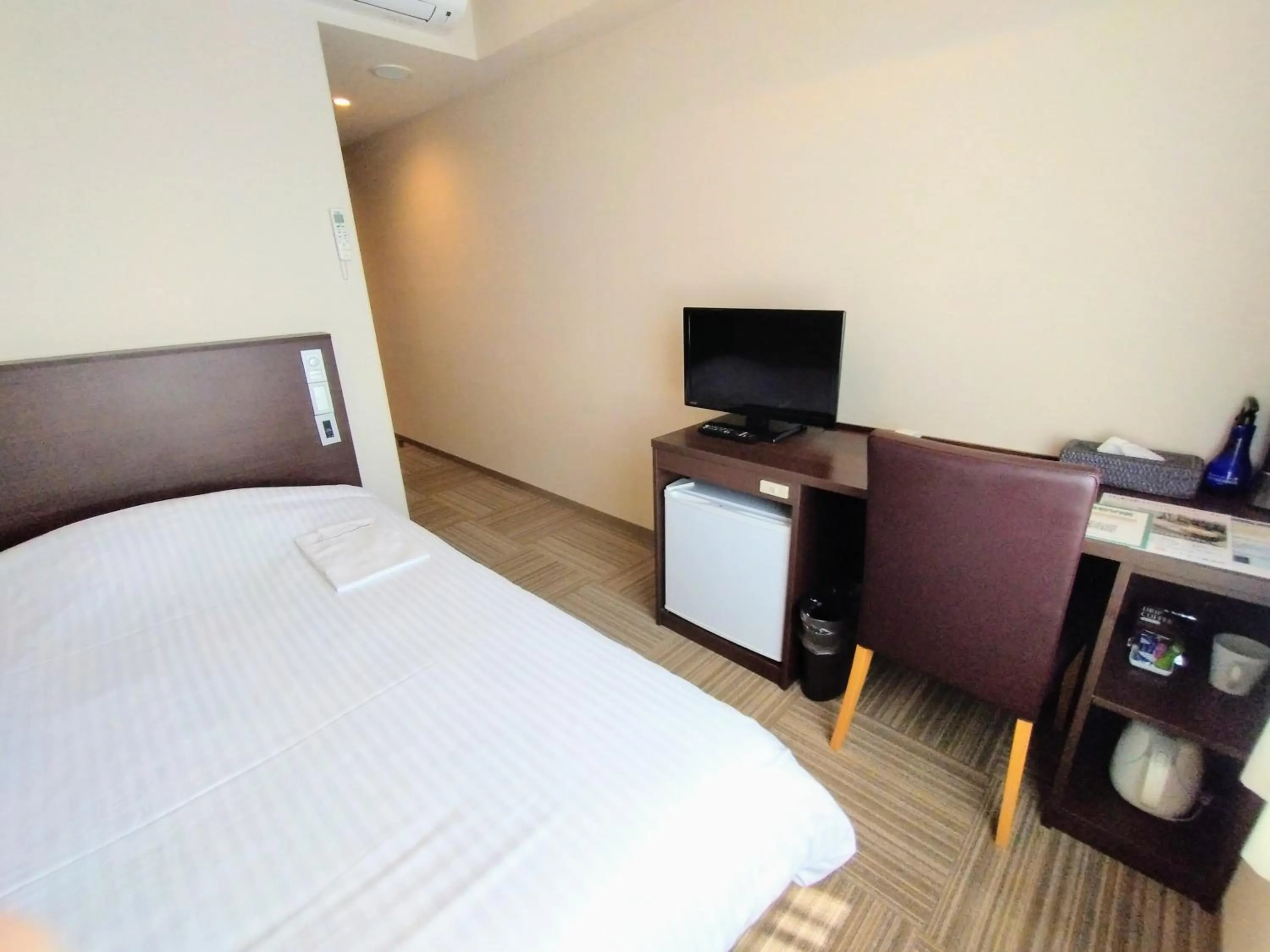 Bed in New Matto Terminal Hotel