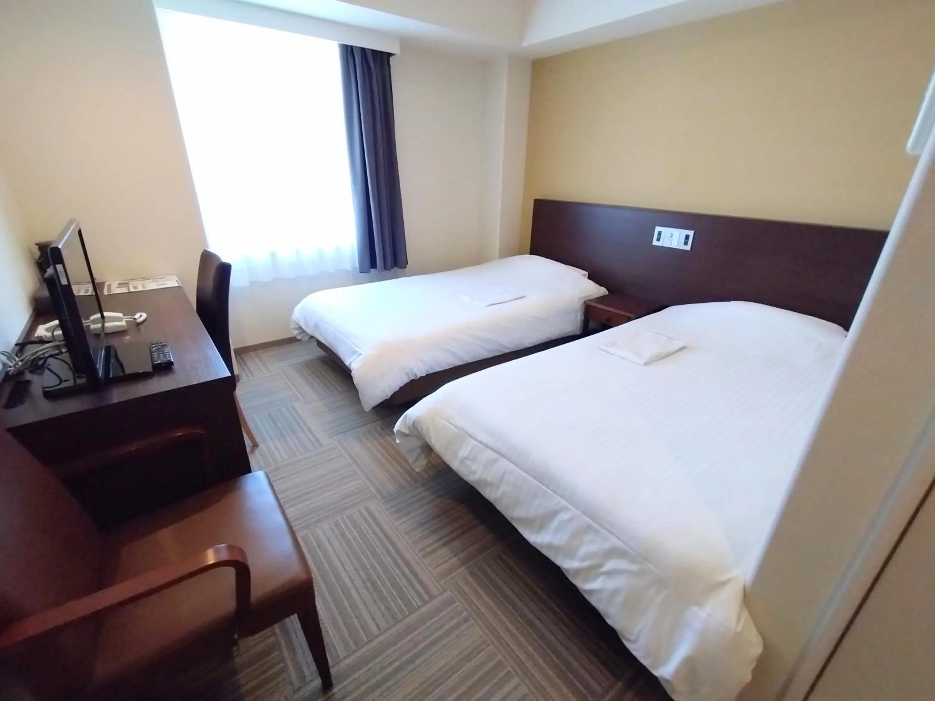 Bed in New Matto Terminal Hotel