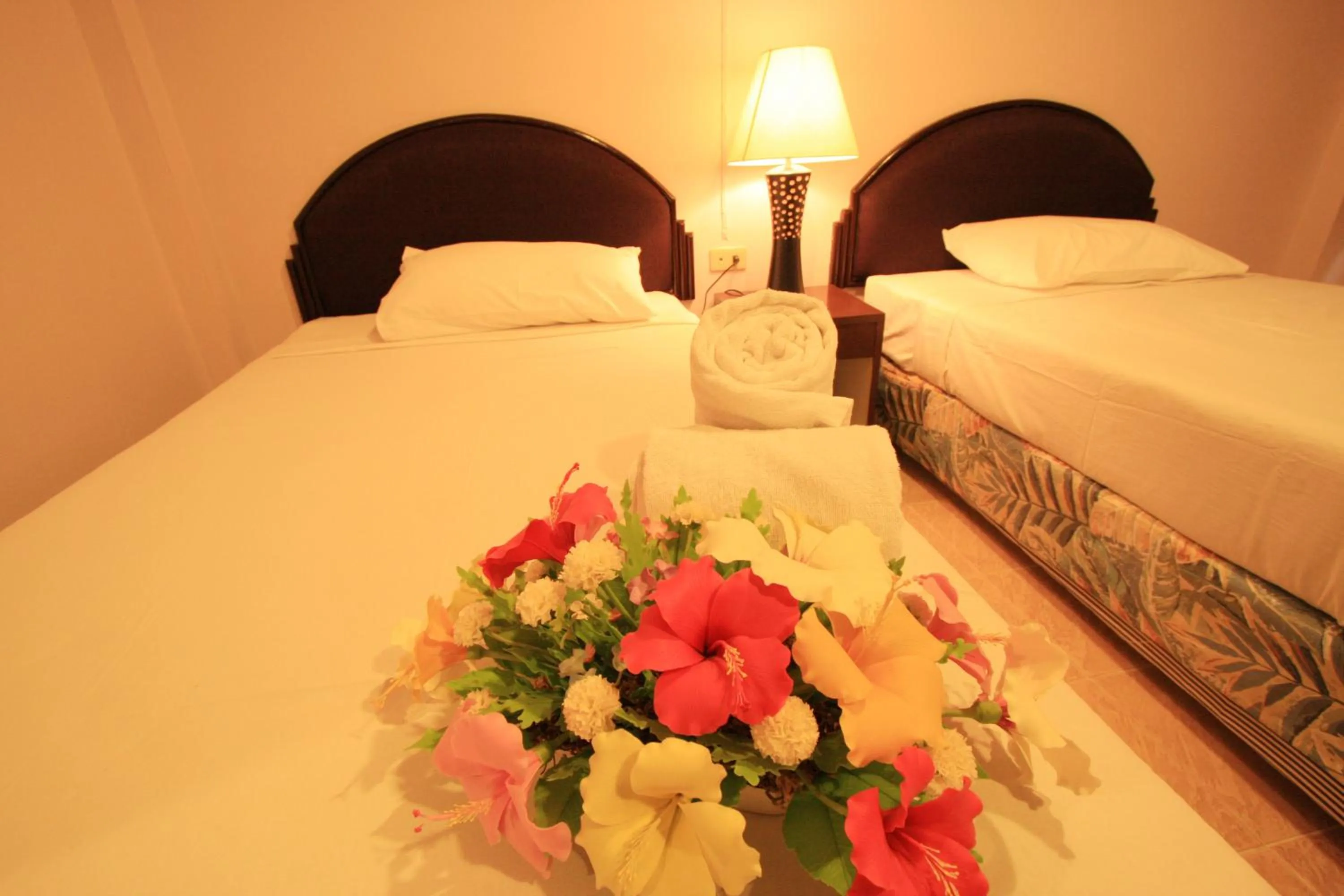 Bed in Chaba Chalet Hotel