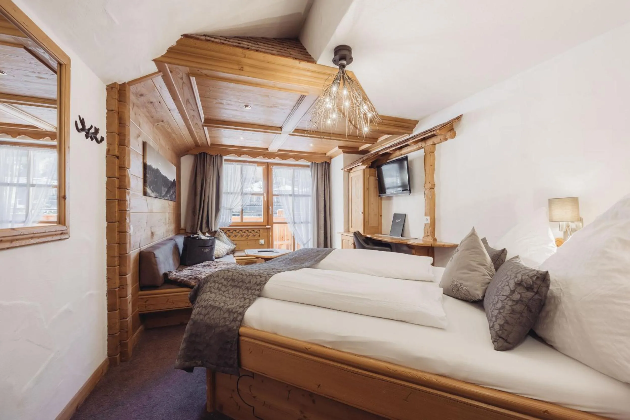 Photo of the whole room, Bed in Genusshotel Vermala Montafon