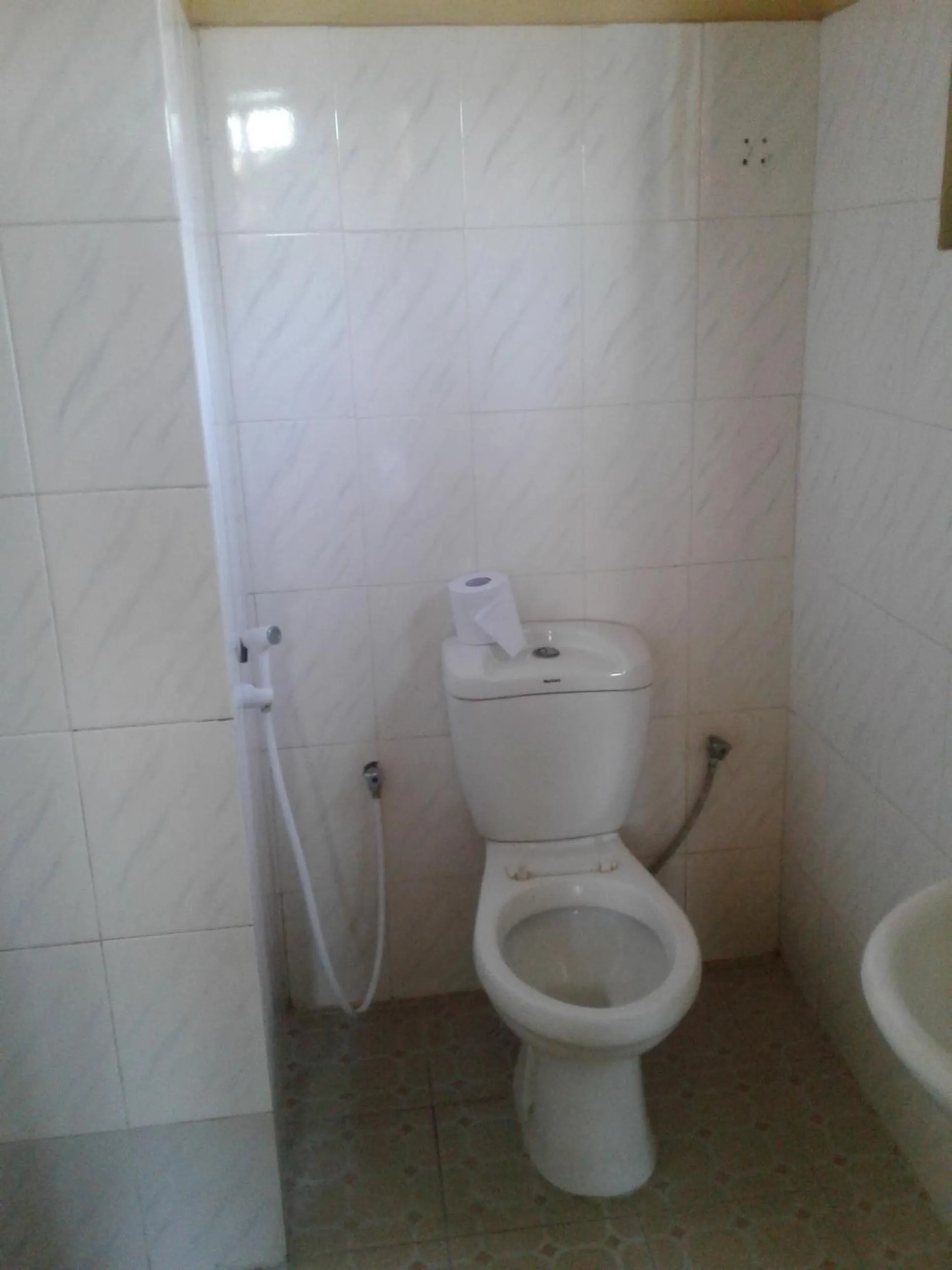 Toilet in JJ & JE Family House