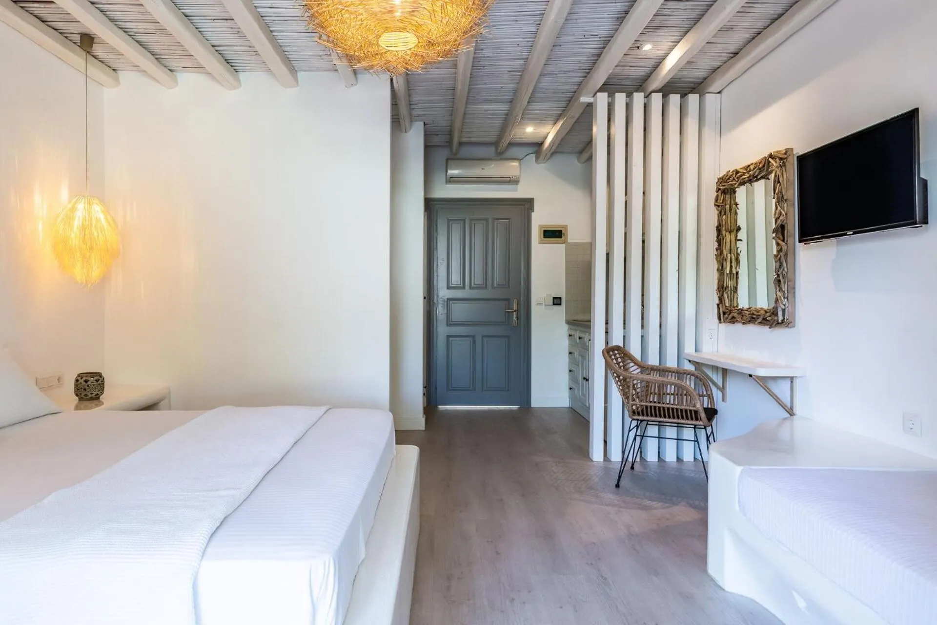 Bed in Evlalia Studios & Villas
