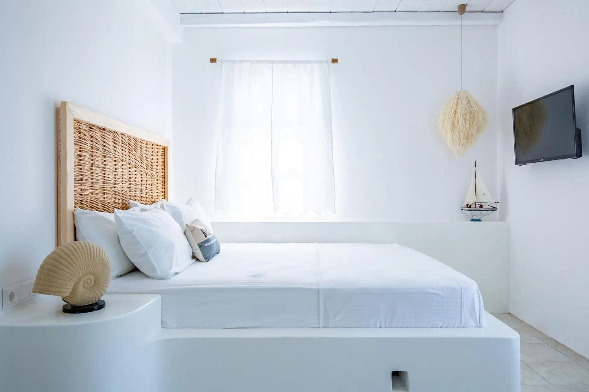Bed in Evlalia Studios & Villas