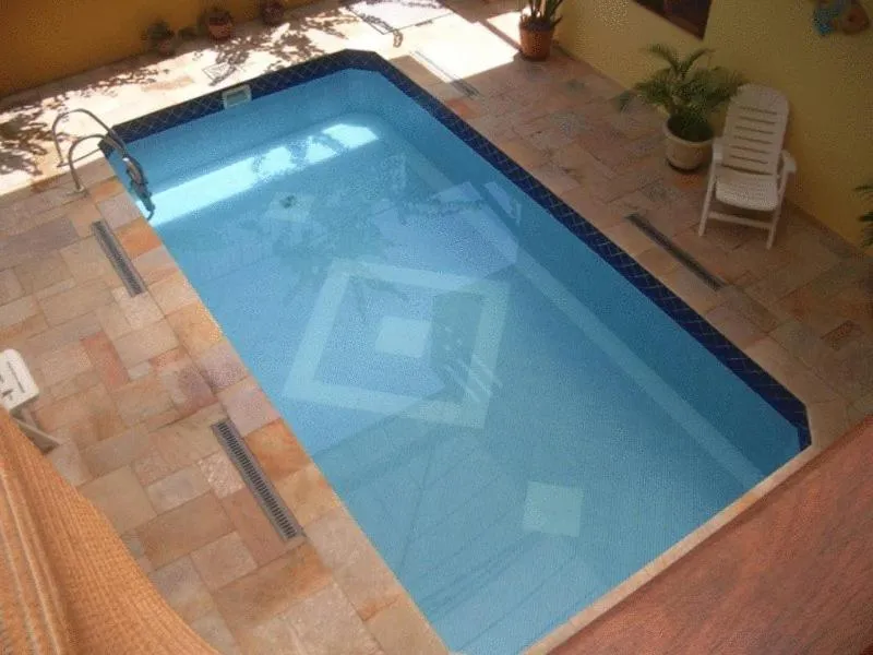 Swimming pool in Pousada Solarium UNIDADE 1 ECONOMICA-BÁSICA
