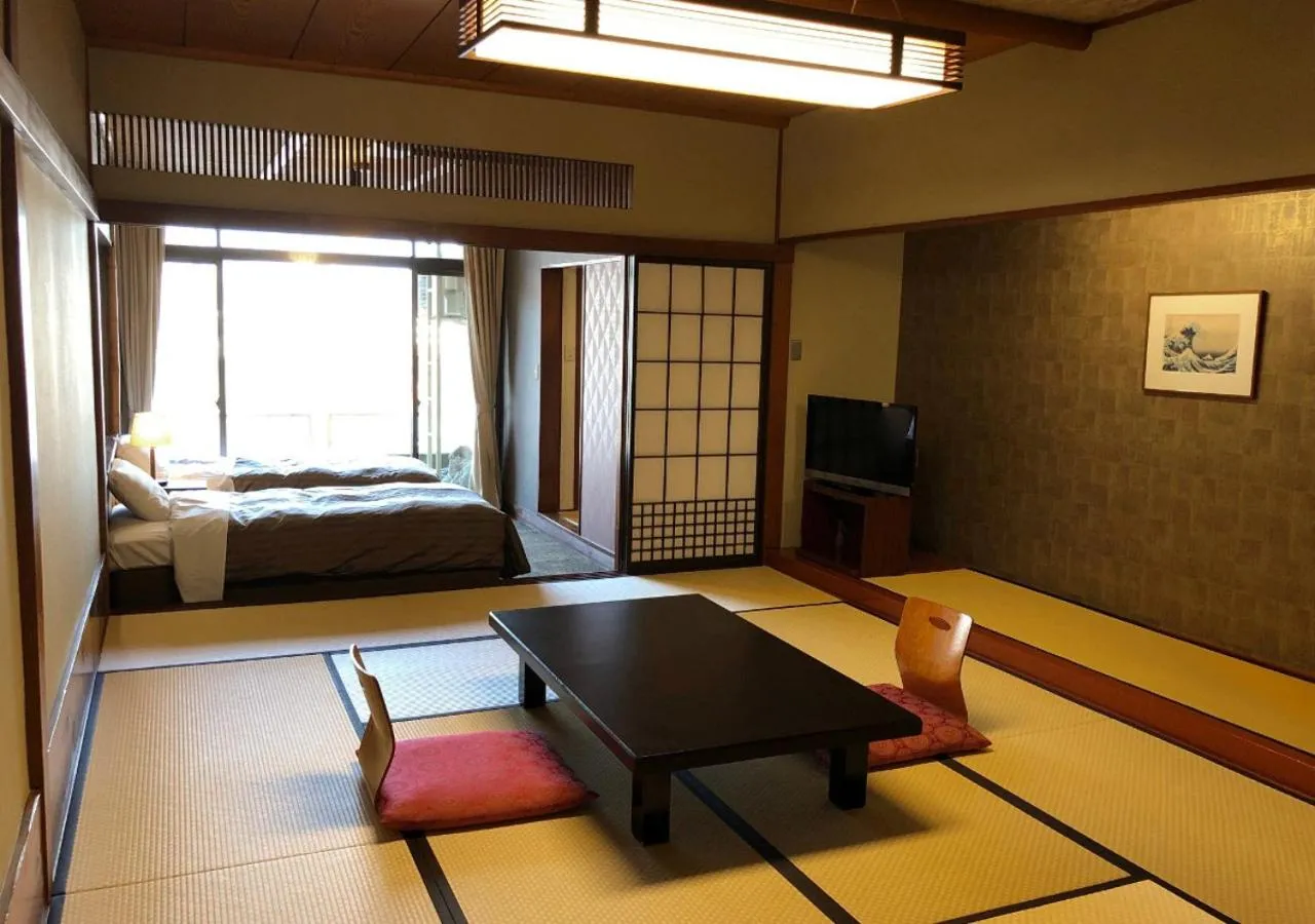 Photo of the whole room, Bed in Atami Kinjokan