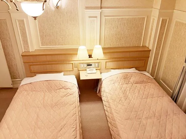 Bed in Yunokawa Kanko Hotel Shoen