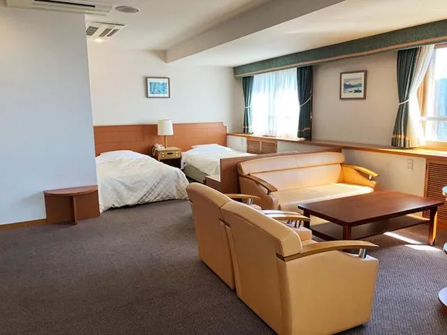 Bed in Yunokawa Kanko Hotel Shoen