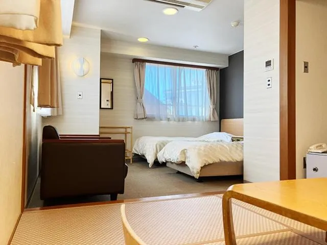 Bed in Yunokawa Kanko Hotel Shoen