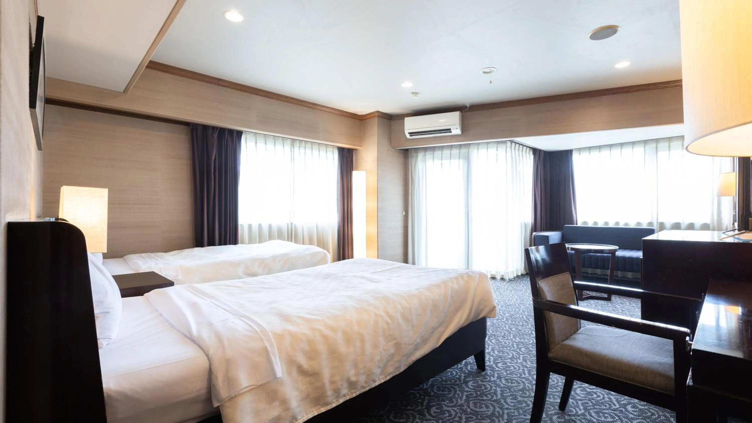 Bed in Atami Season Hotel