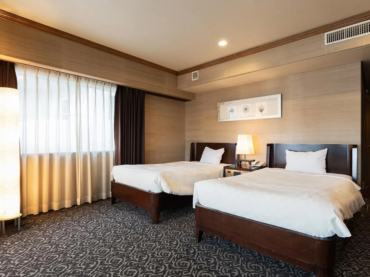 Bed in Atami Season Hotel