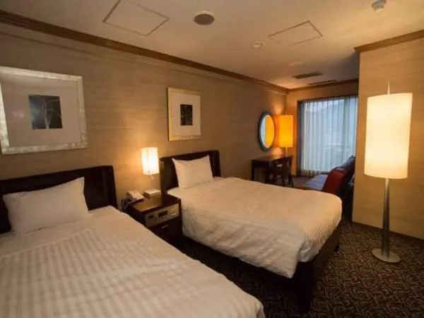 Bed in Atami Season Hotel