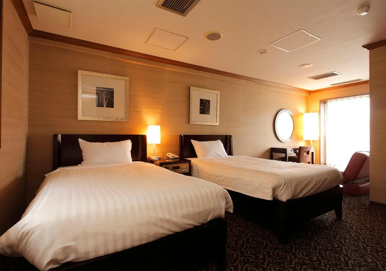 Bed in Atami Season Hotel