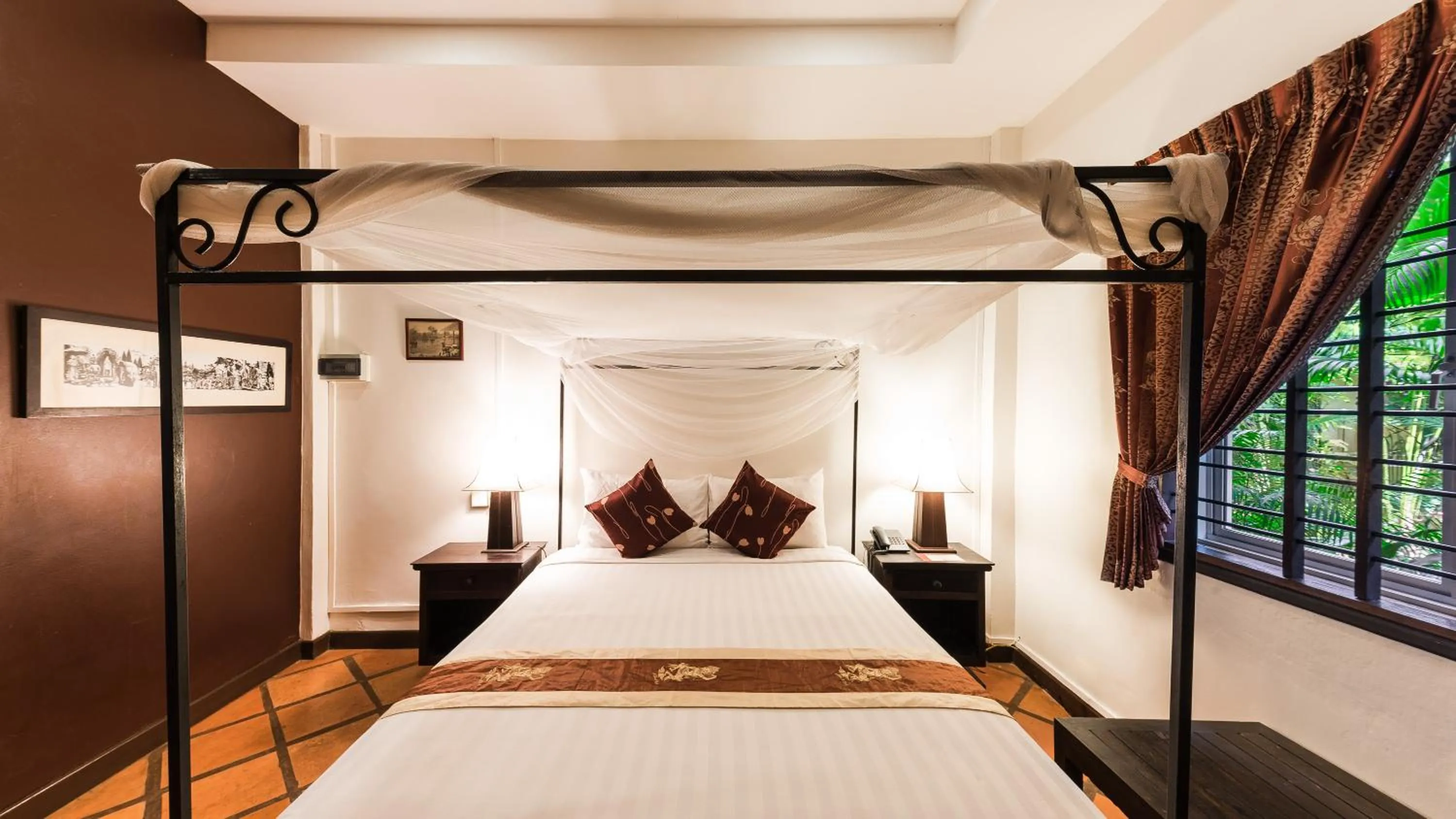 Bed in Pavillon Indochine Boutique - Hotel