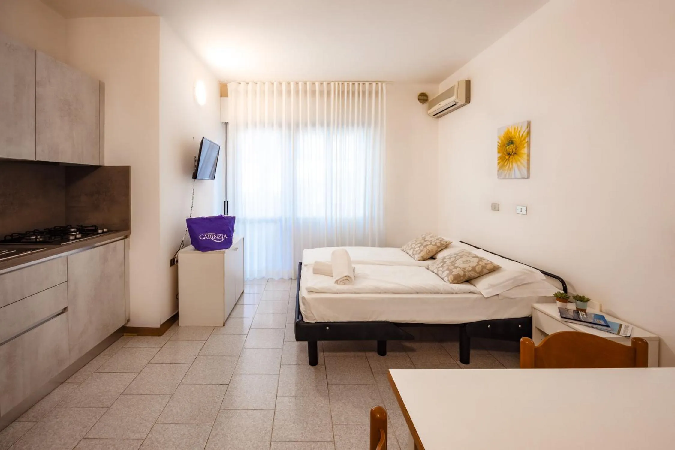 Kitchen or kitchenette, Bed in Aparthotel Carinzia