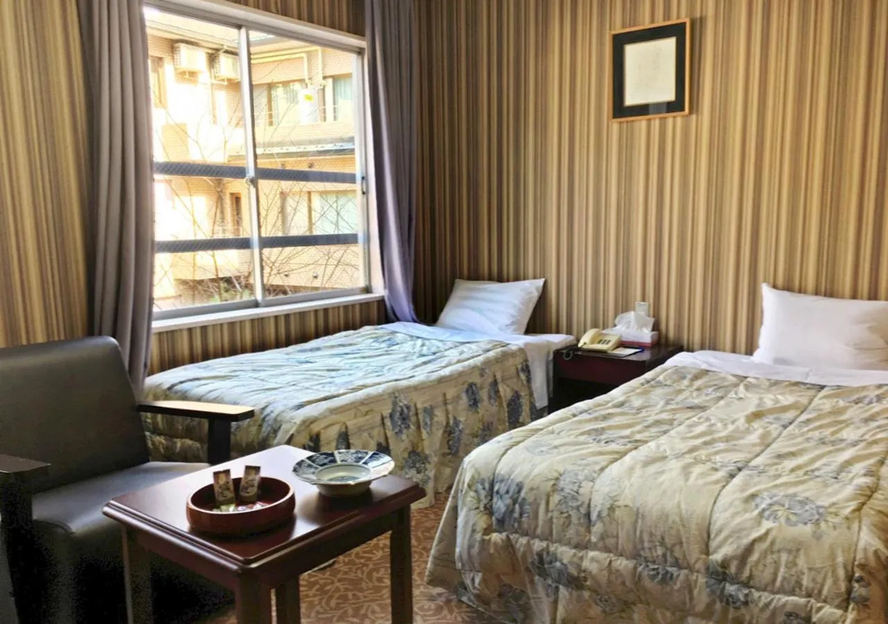 Photo of the whole room, Bed in Itoen Hotel New Sakura