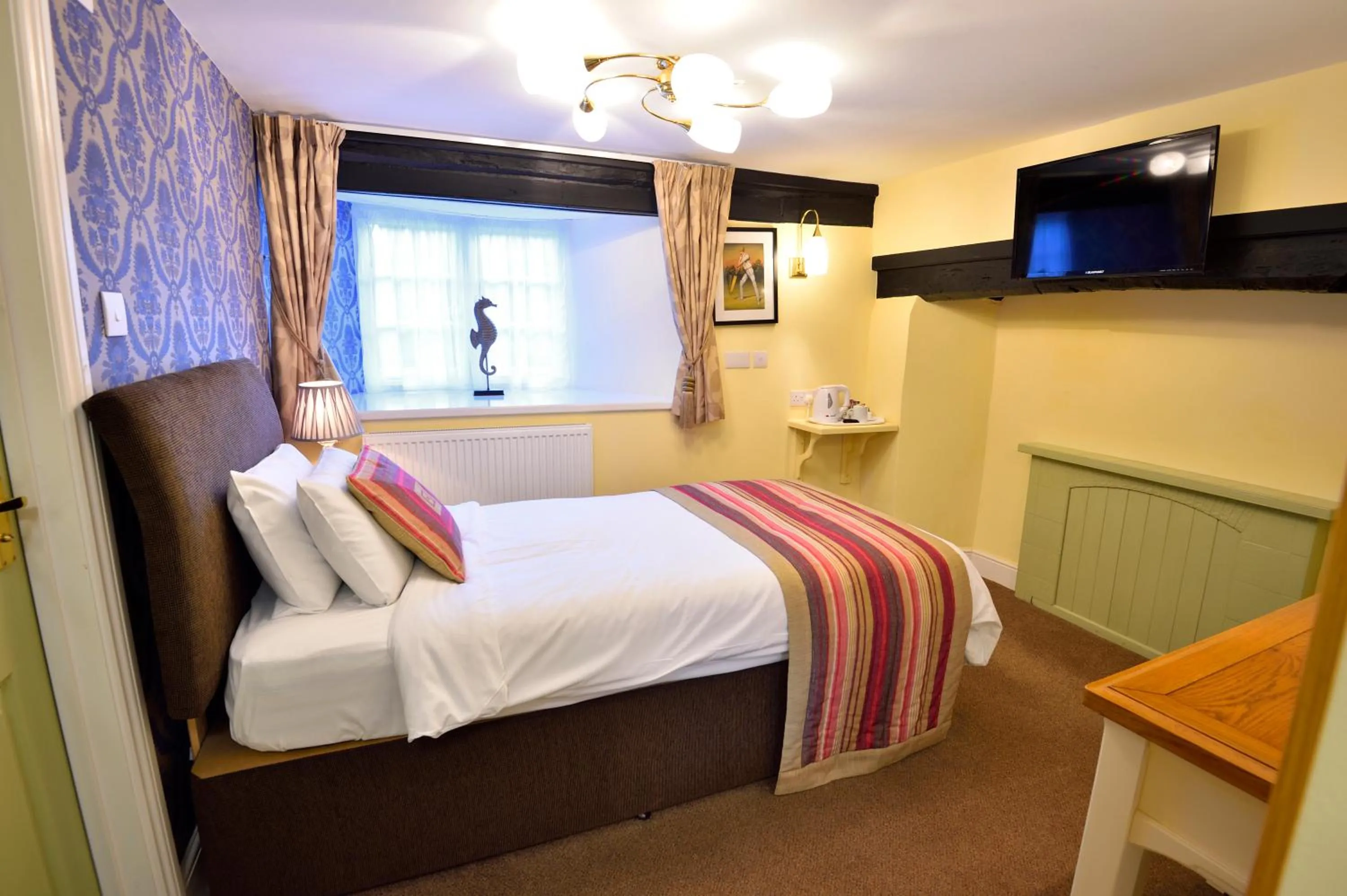 Bed in The Royal Victoria and Bull Hotel