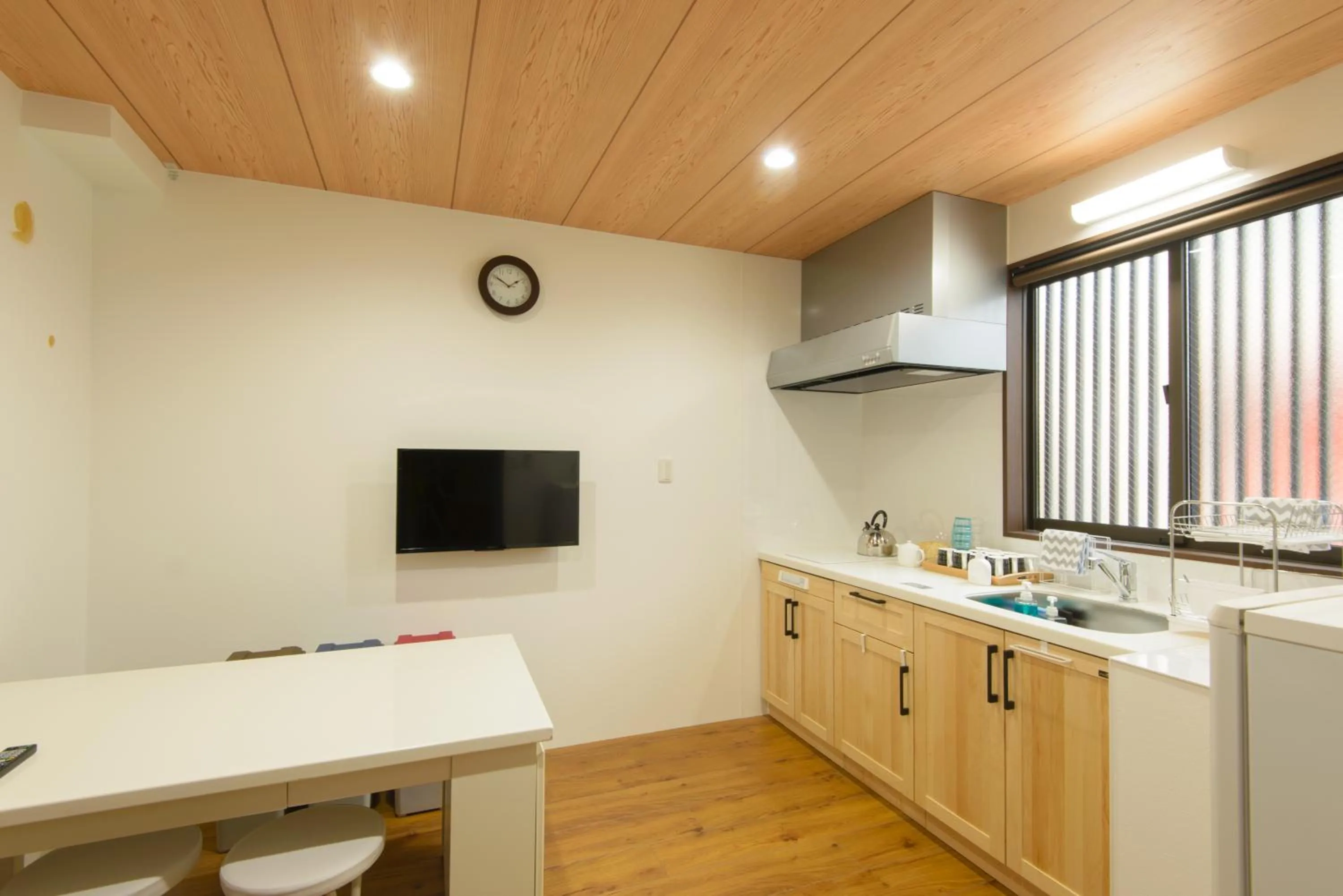 Communal lounge/ TV room in Guesthouse Kintoto