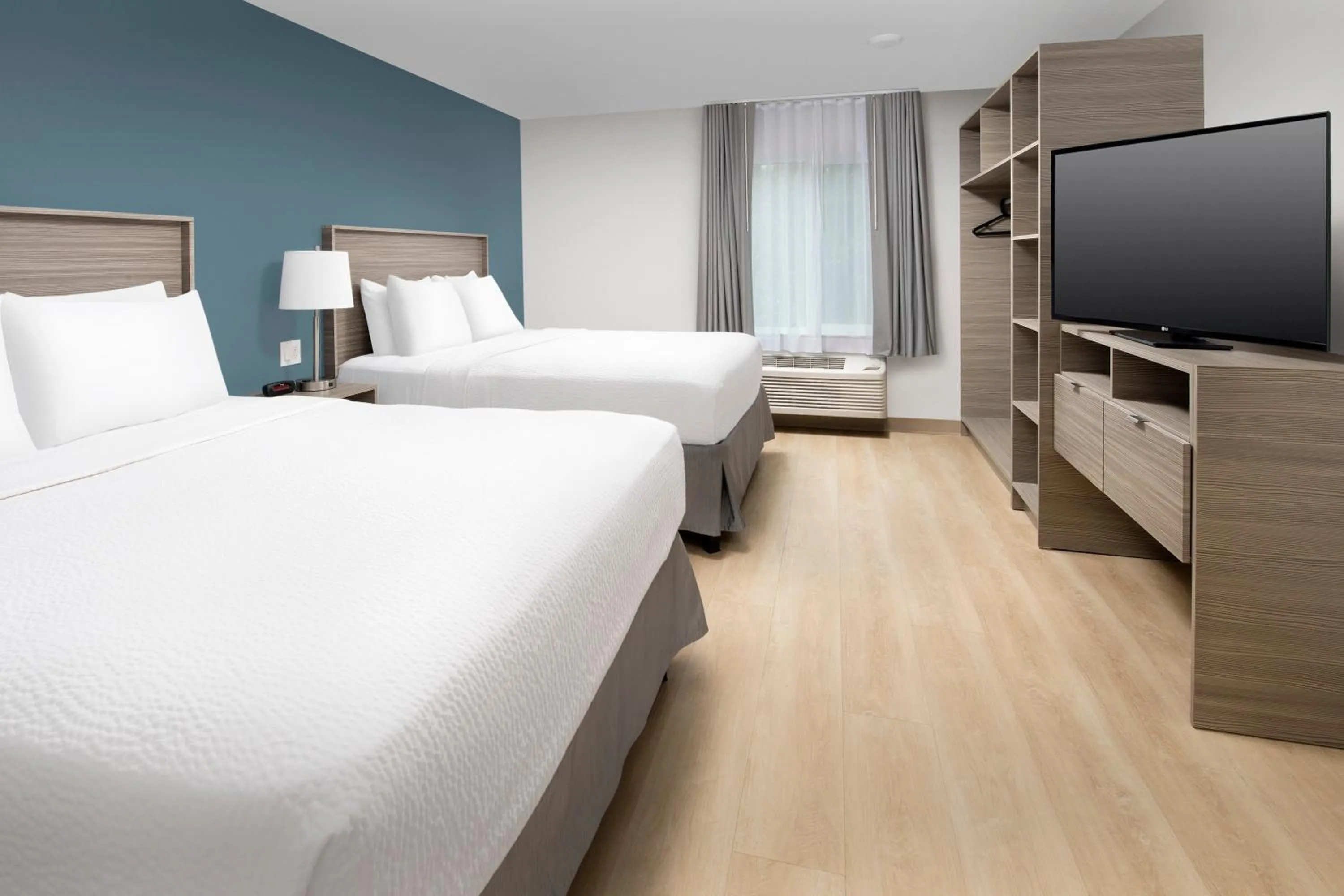 Photo of the whole room, Bed in WoodSpring Suites Seattle Redmond