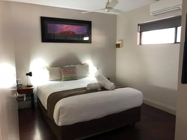 Bed in Alice On Todd Apartments