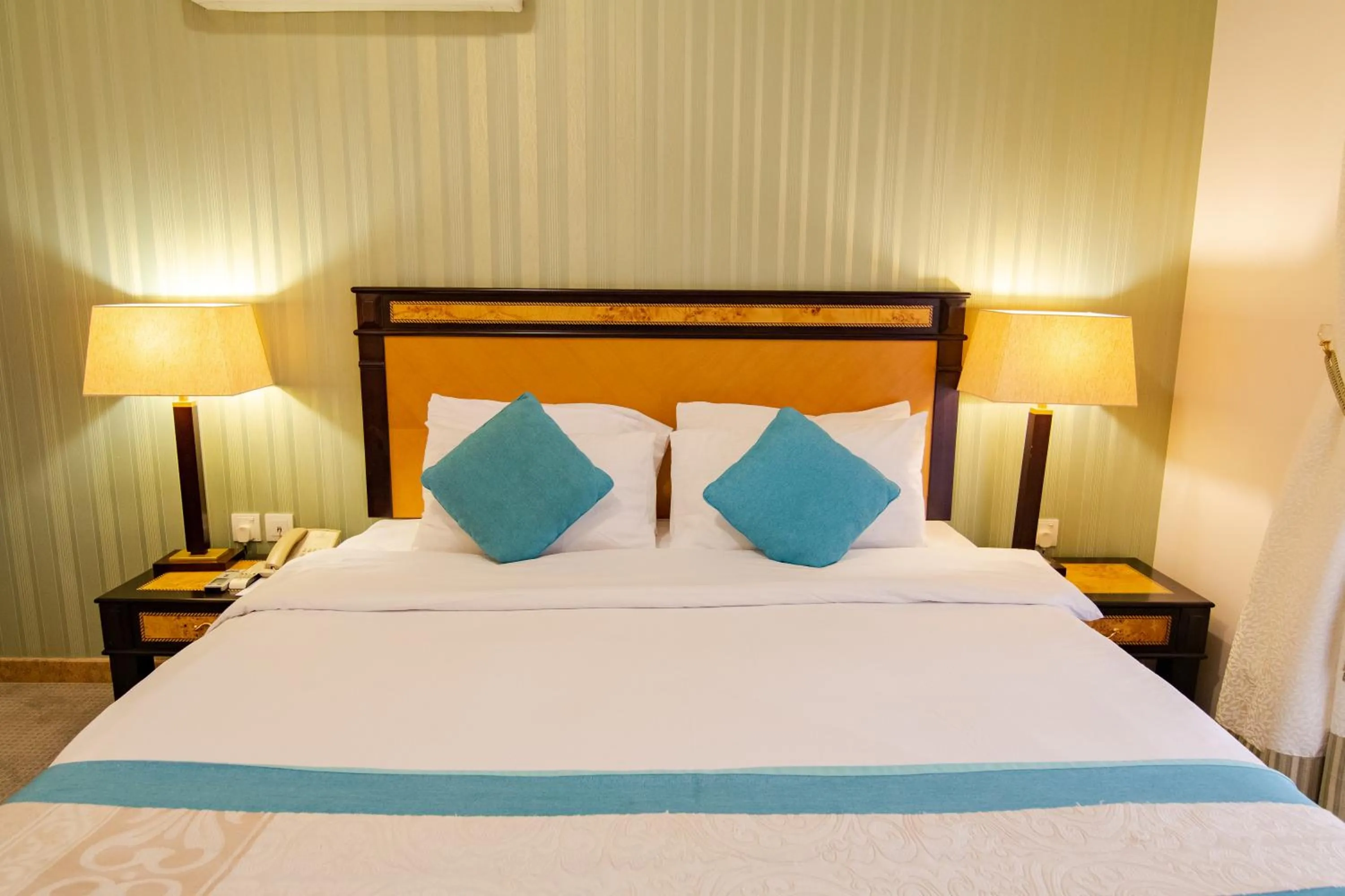 Bed in Garden Hotel Muscat By Royal Titan Group