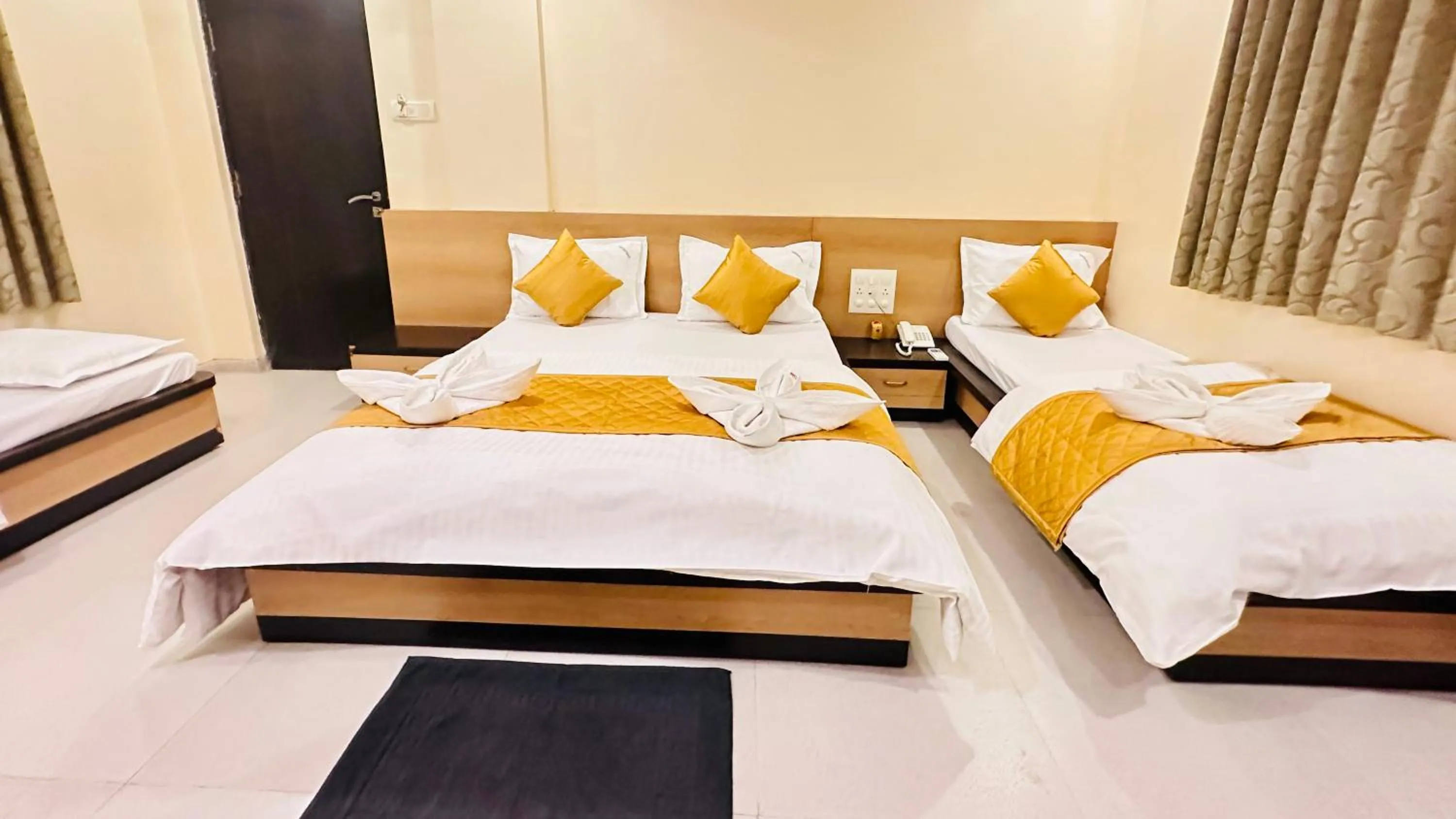 Bed in Hotel Sai Gurusthan