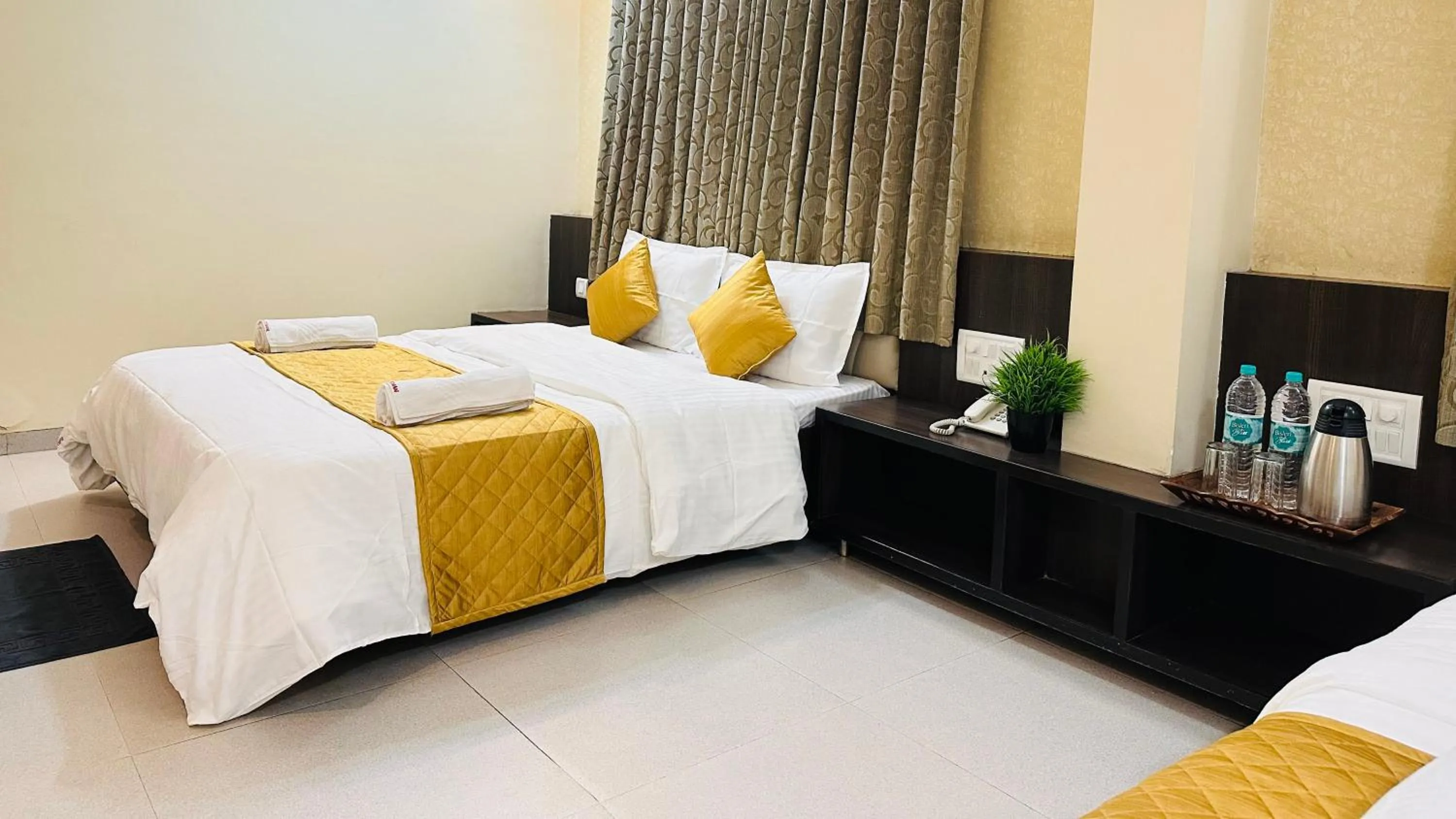 Bed in Hotel Sai Gurusthan