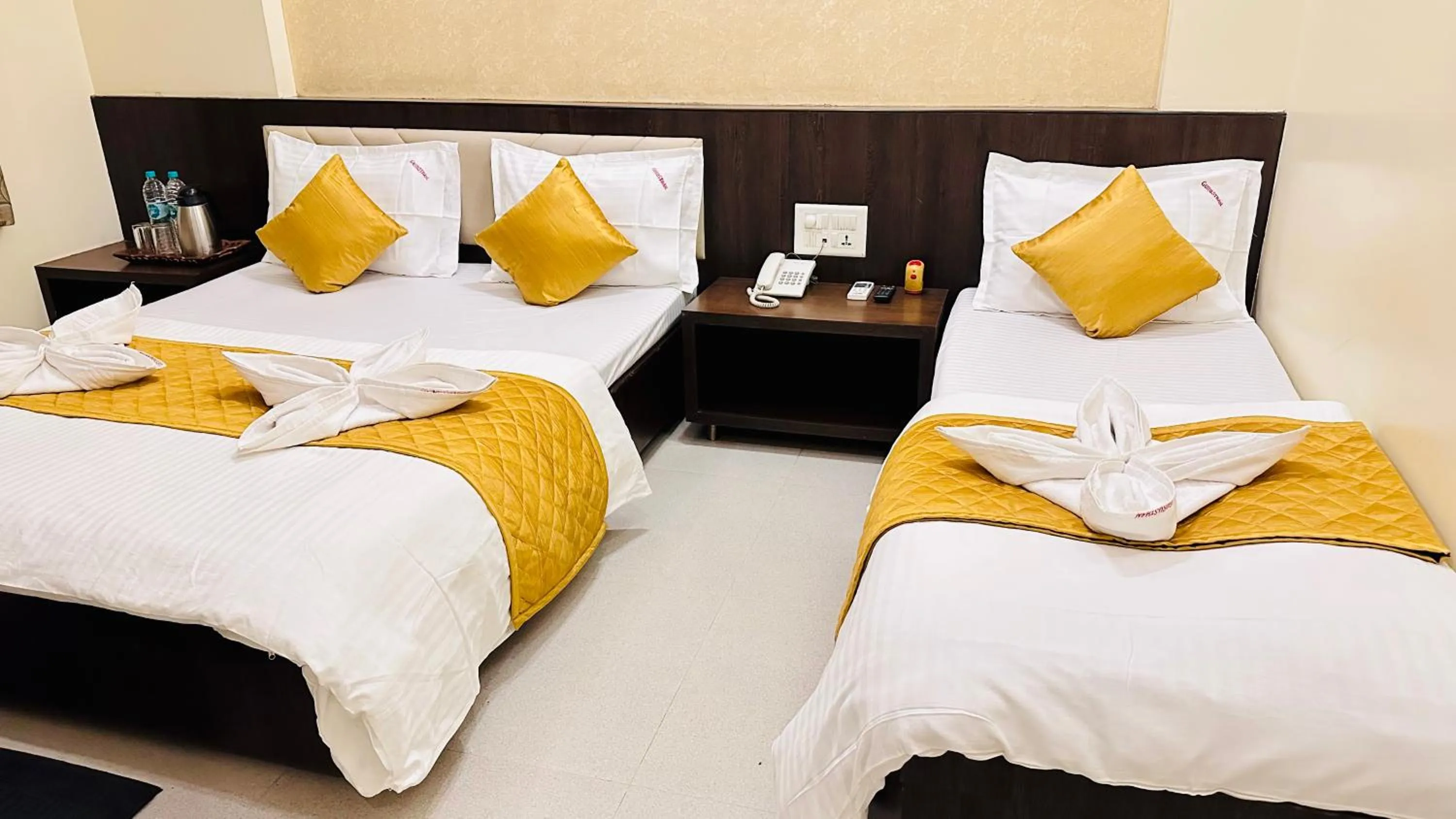 Bed in Hotel Sai Gurusthan