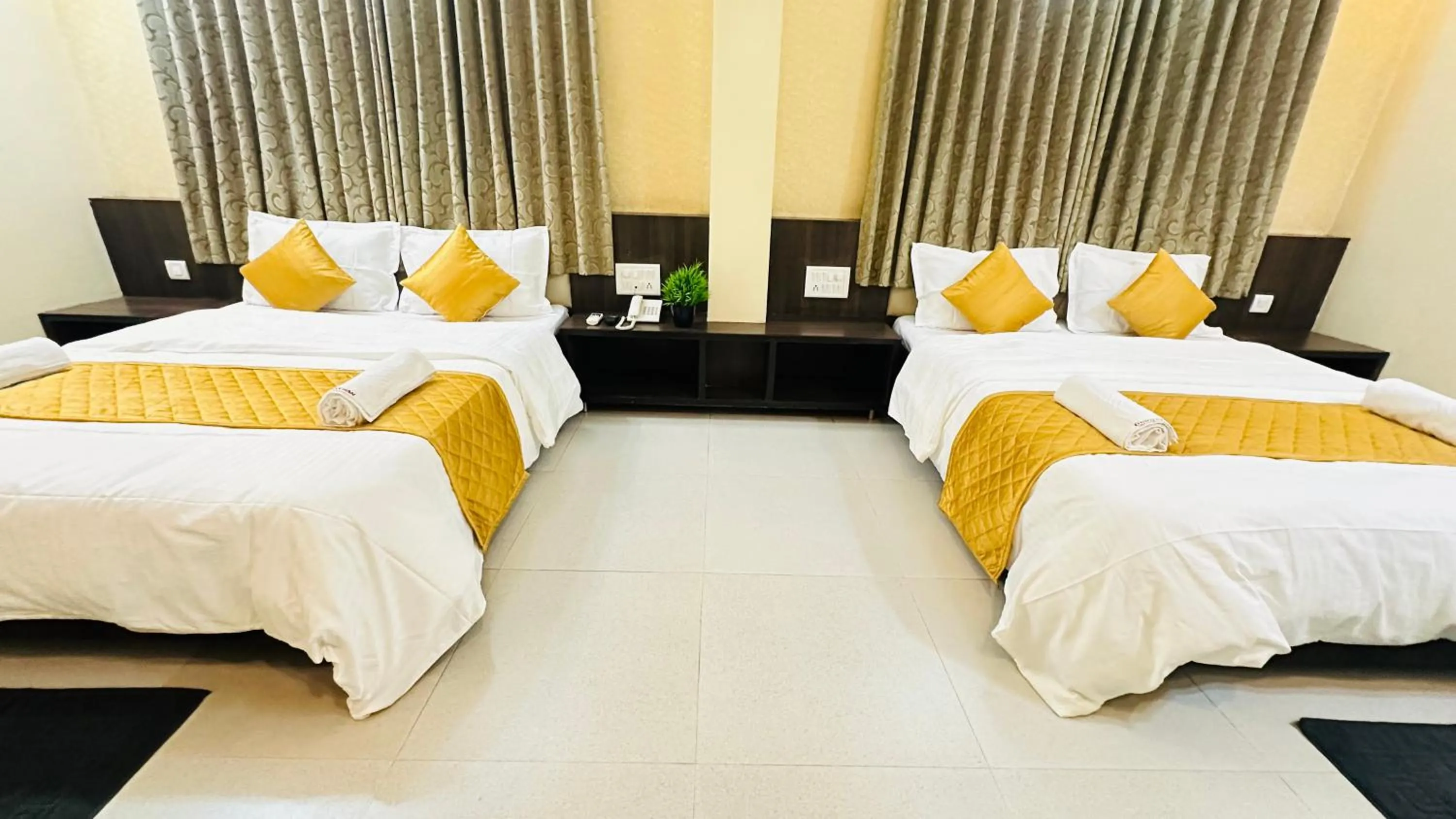 Bed in Hotel Sai Gurusthan