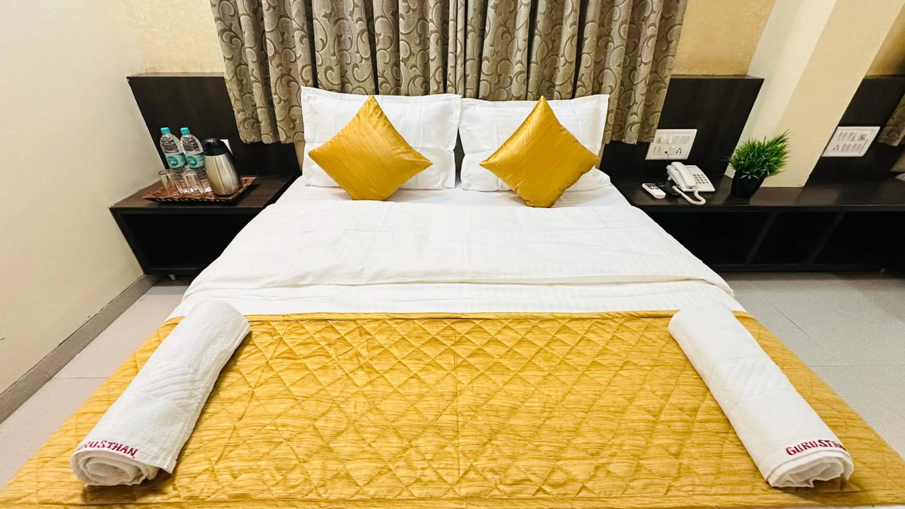 Bed in Hotel Sai Gurusthan