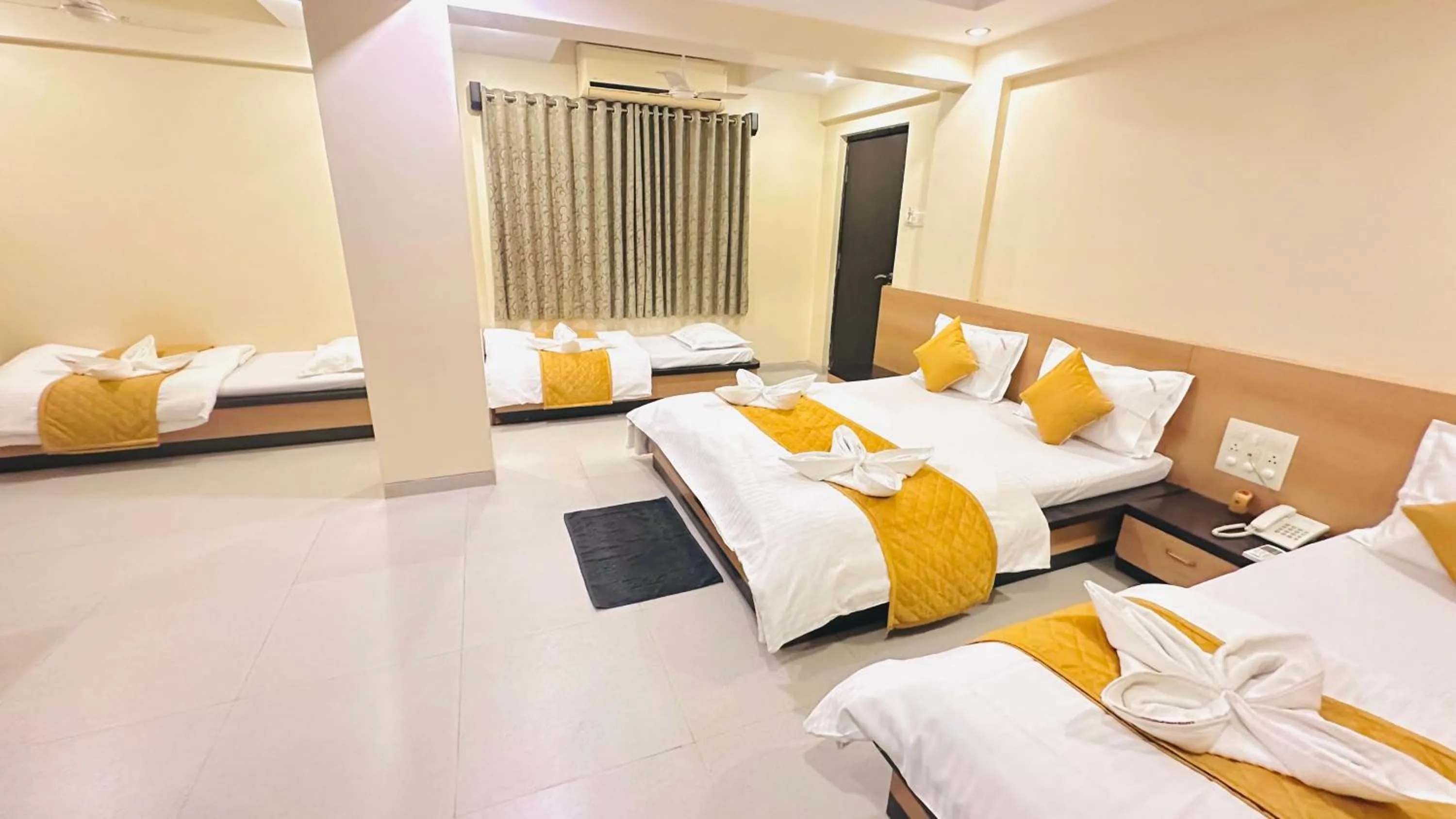 Bed in Hotel Sai Gurusthan