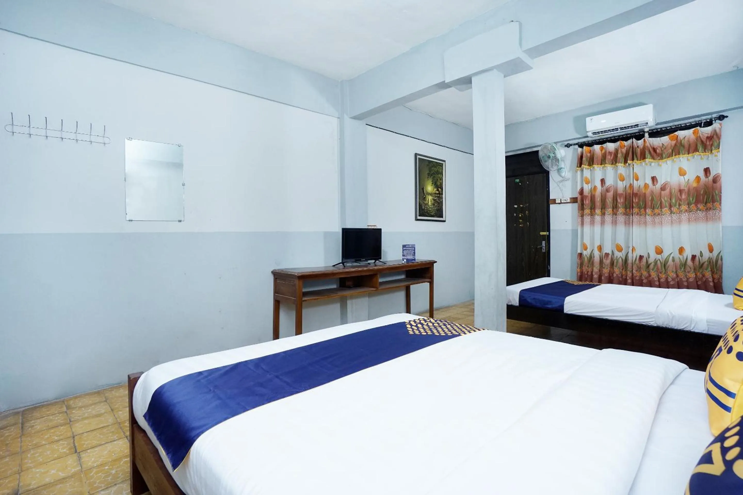 Bedroom in SPOT ON 2857 Hotel Pelangi