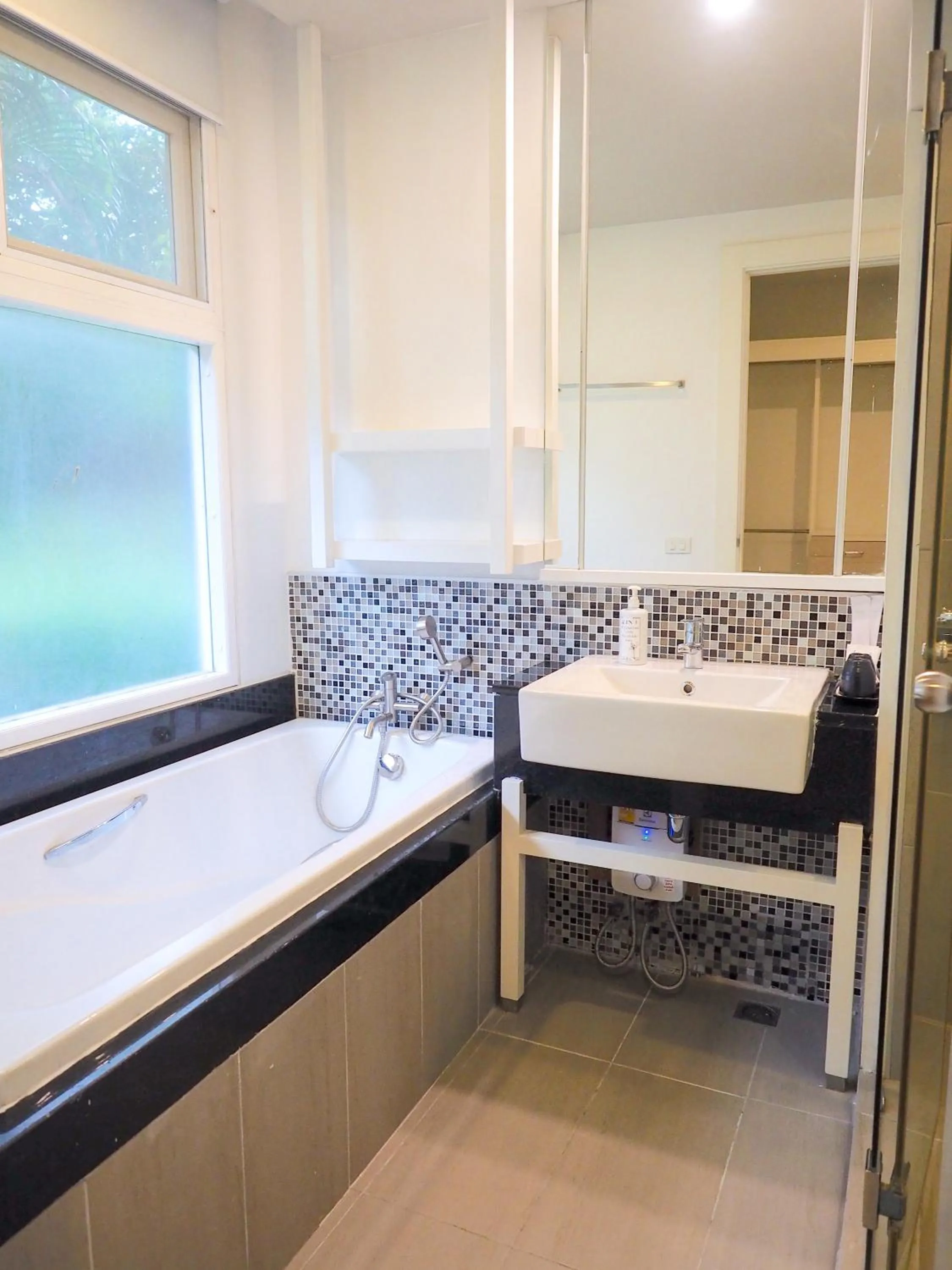 Bathroom in THE KANNAS Hotel & Serviced Apartment, Chiang Mai SHA Certified