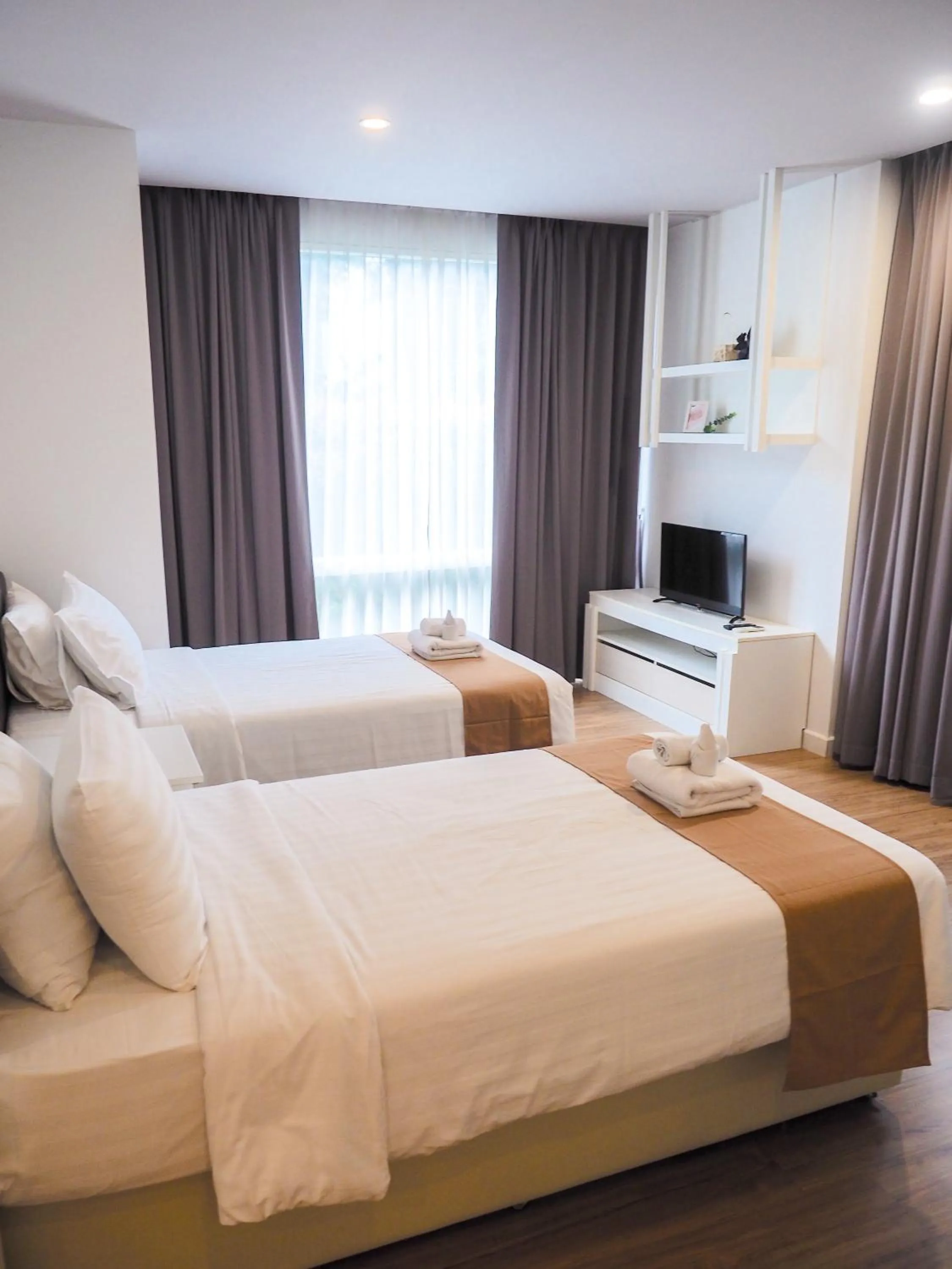 Bed in THE KANNAS Hotel & Serviced Apartment, Chiang Mai SHA Certified